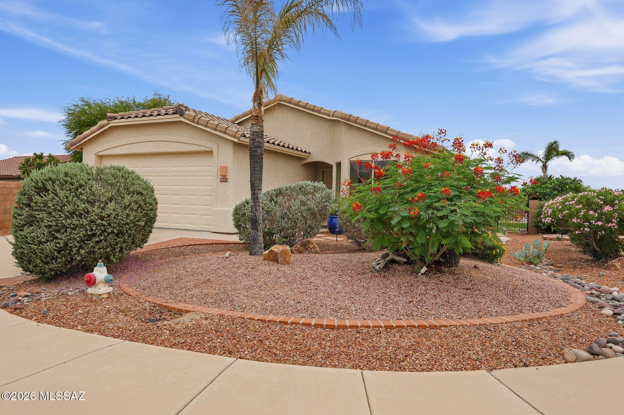 Welcome home! Beautifully remodeled 4 bedroom, 2 bath single story home situated on a spacious corner lot. The inviting kitchen offers plenty of cabinet and counter space, quartz countertops, SS appliances, pantry and a charming breakfast nook with a bay window.
The spacious primary suite features a walk-in closet and an en-suite bath with dual vanities and a walk-in shower. The 4th bedroom offers unique flexibility with access from both the primary bedroom and hallway, making it ideal as a sitting room, den, home office or nursery. It can also be enclosed from the primary bedroom to create a separate 4th bedroom. Step outside to an entertainer's backyard designed for relaxing and gatherings. Enjoy the tranquil water feature and Beehive outdoor fireplace. The home is Move in Ready! Enjoy the covered patio, low-maintenance artificial turf, flagstone walkway, mature trees, water feature and a beautiful sitting area centered around a bee hive fireplace. With thoughtful updates and versatile living spaces, this home offers comfort, functionality and plenty of room to enjoy Arizona living.