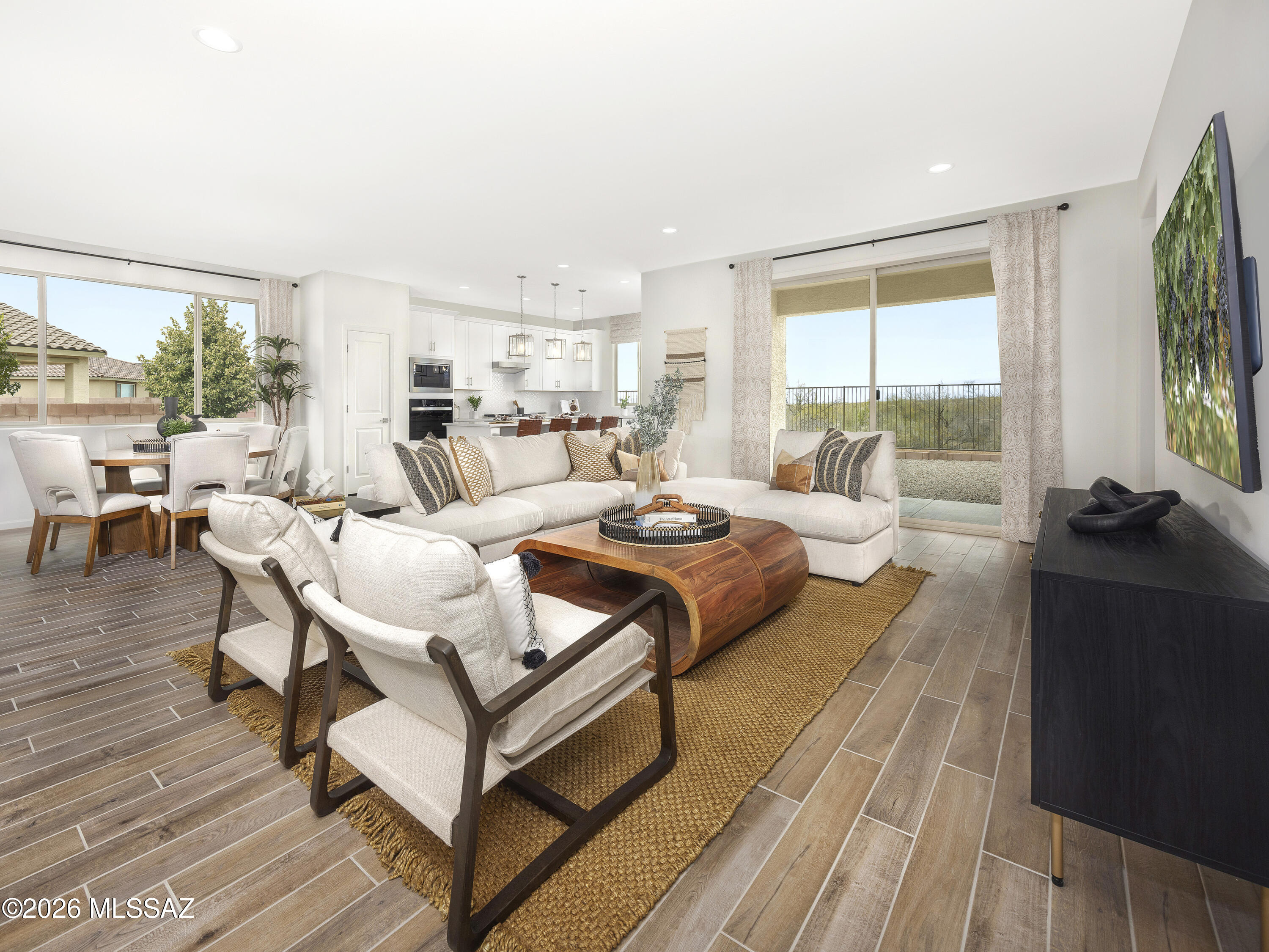 Your dream home awaits! This spacious 4-bedroom, 3-bath floorplan showcases an oversized primary suite complete with a private bath and generous walk-in closet. Three additional bedrooms provide flexibility for family, guests, or a home office, while versatile garage options add even more functionality. Located in Arbor at Madera Highlands, you'll enjoy open-concept living, gourmet kitchens, upgraded finishes, and a choice of five thoughtfully designed floorplans. Community amenities include a pool, playground, and scenic walking trails. Move-in ready with a washer, dryer, refrigerator, and whole-home blinds. Built with innovative energy-efficient features designed for greater comfort, healthier living, and everyday savings.