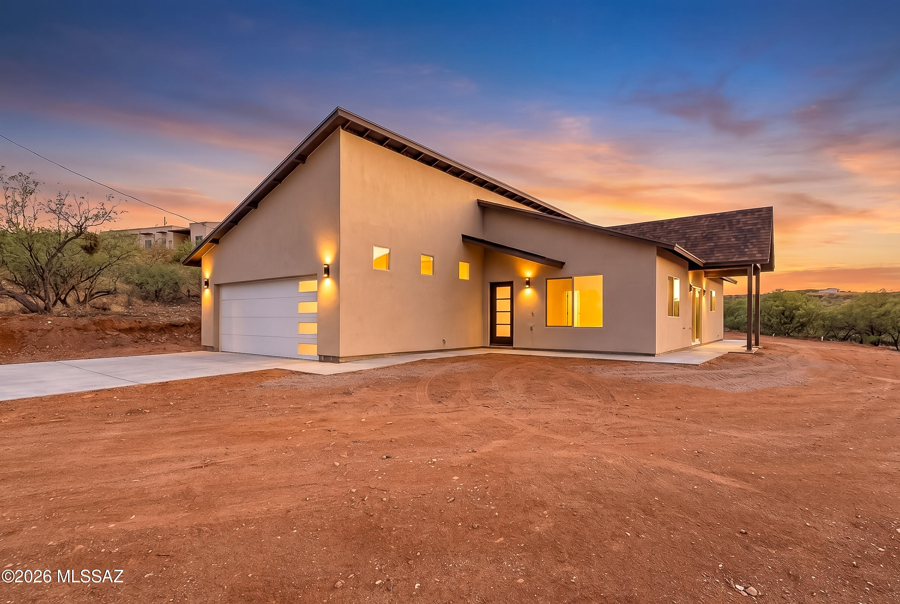 Experience a solid, well-crafted new construction home built by a reputable builder known for quality and attention to detail. This 1,750 sqft residence showcases a sleek contemporary design with high-end finishes throughout, offering both style and functionality. Featuring 3 spacious bedrooms and 2 beautifully designed bathrooms, the layout is open, modern, and built for everyday living and entertaining. Situated on a desirable 0.67-acre corner lot, this property provides added space, privacy, and curb appeal. Conveniently located just minutes from Rio Rico amenities, this home delivers the perfect balance of quality construction, modern design and location.