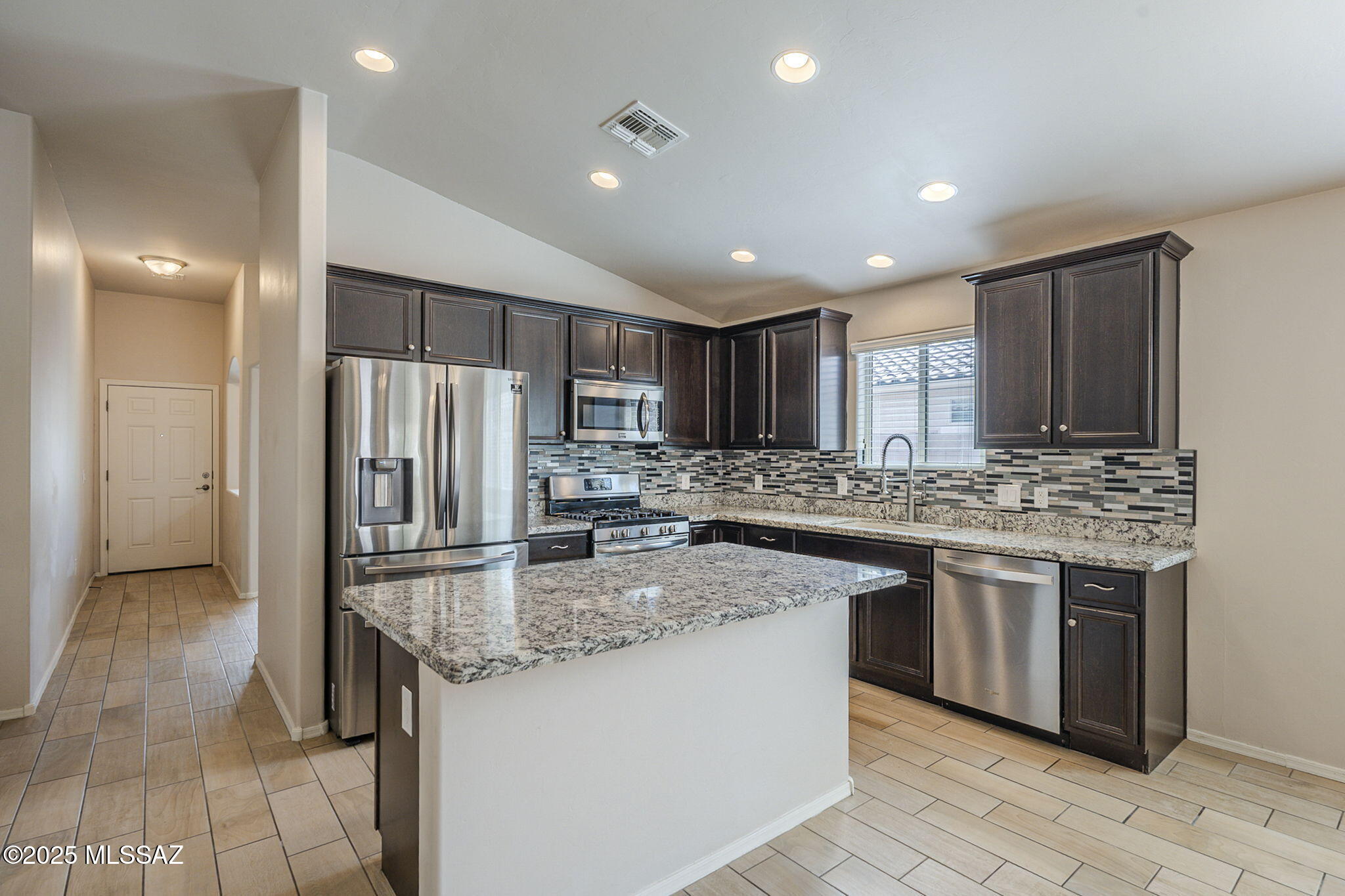 Seize the opportunity to own this stunning 4-bed, 2.5-bath home in the Saguaro Bloom community. The seller is ready to deal! This beautifully designed residence features an open-concept kitchen that flows effortlessly into the dining and family rooms--perfect for entertaining.

Retreat to the impressive primary suite boasting a generous layout and walk-in shower. Outside, enjoy a fully landscaped oasis with an extended covered paver patio and low-maintenance turf. splash pad, playgrounds, and scenic walking/biking pathsoffering the best of comfort, convenience, and lifestyle.