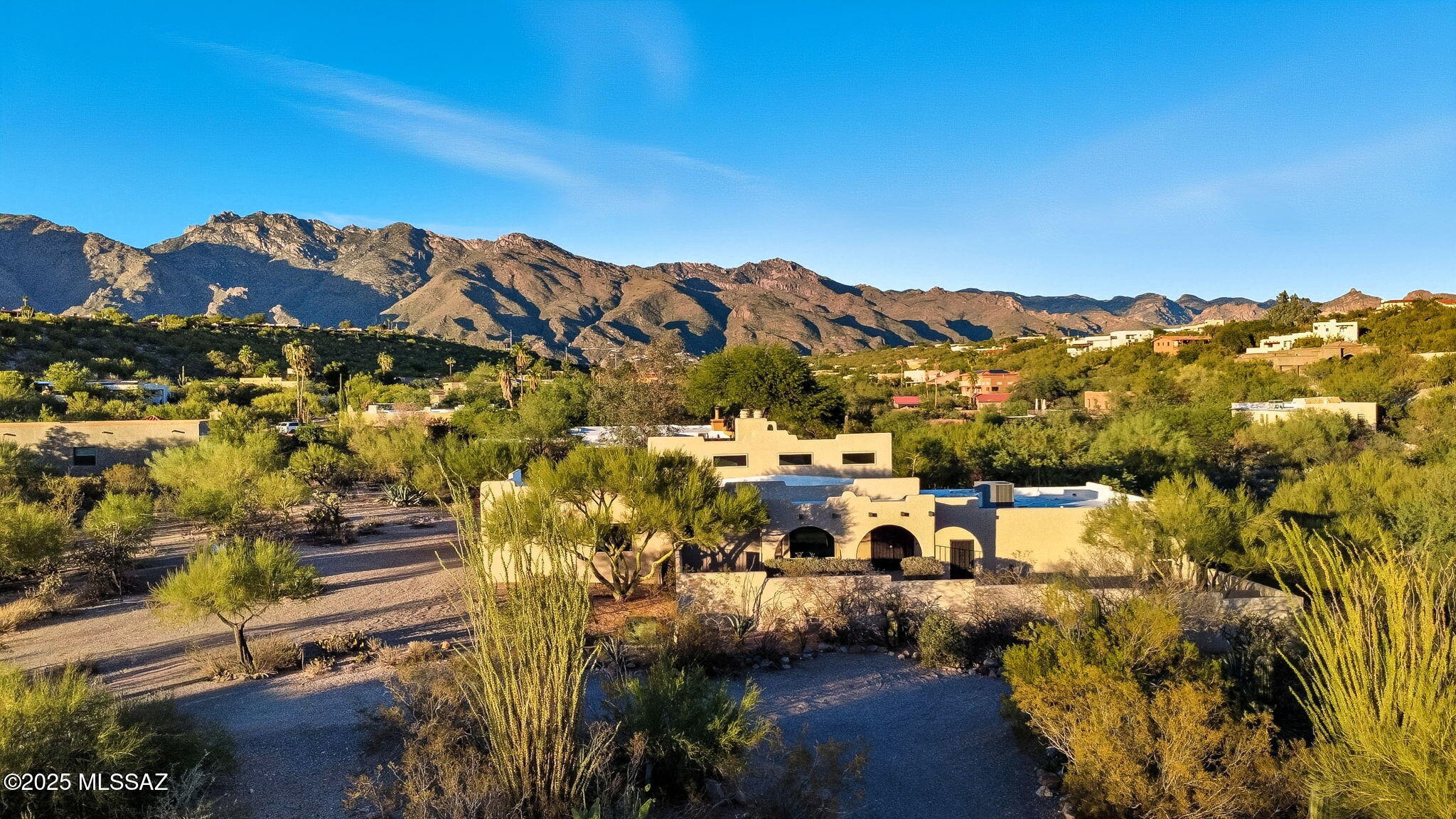 LUXURY LIVE AUCTION! Bidding to start from $600,000.00!  SPECIAL PREVIEW OPEN HOUSE THURSDAY APRIL 2ND @ 4:00 PM - 6:00 PM!  
Best Value in Fairfield in the Foothills community! If you've been waiting for a Tucson foothills home with space, mountain VIEWS, and a pool at an exceptional price, this is the opportunity! Tucked away in the desirable Sunrise Territory Village, this custom home on 3/4 acre, welcomes you with a long driveway, a paver walkway, and a charming gated courtyard framed by a mature native Palo Verde tree and classic Southwestern arches.
Inside, high ceilings, abundant natural light, and warm wood architectural details create a comfortable desert retreat. The living room features a picture window with bay seating overlooking the pool and Catalina Mountains. A dual-sided fireplace adds ambiance to both the living and family rooms.
The spacious kitchen is designed for entertaining, featuring expansive rich cabinetry with pull-outs, granite countertops, double oven, and a large island that flows into the family room, the home's natural gathering space. With four bedrooms, the flexible layout offers room for guests, family, or a home office. One guest bedroom has private access to the front courtyard, while the primary suite offers its own north-facing patio and direct access to the sparkling pool and spa. A third full bathroom can be accessed from the back yard, convenient on those summer-splash days! 
Additional highlights include a freshly epoxied garage floor, oversized storage room, and recently recoated roof with transferable warranty. Located in the lush rolling desert hills, residents enjoy peaceful desert surroundings and walking paths just minutes from the world-renowned Sabino Canyon recreation area, Piazza Gavi, and El Charro Restaurants, and healthy shopping at Whole Foods. A rare chance to own a foothills home with views, pool, and flexible living spaces in one of Tucson's most desirable communities!