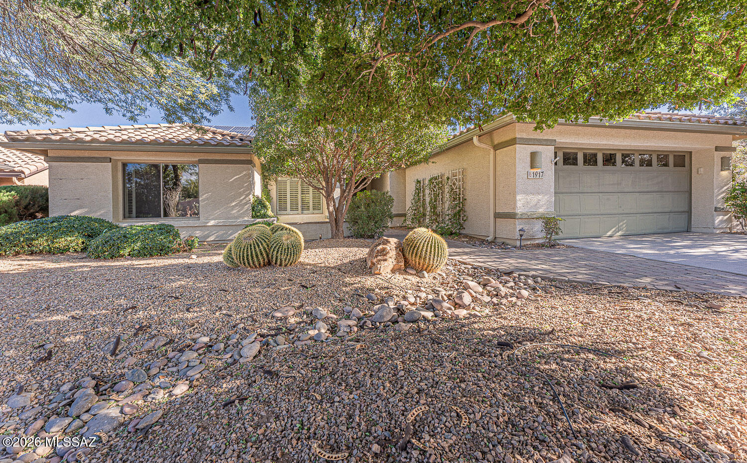 Perfectly imperfect... aren't we all? Beauty that is created from years of mature growth and care boasting a lush landscape and a wonderful floor plan. Backing up to a picturesque arroyo offering further privacy and enhancing its already fantastic setting. Recent investments in a new roof and newer HVAC, in case you were at all concerned about its 22 year age (heck, what we all wouldn't give to be only 22!). Solar added, with a very user friendly lease, supplying electric for barely 2 dollars a day!  Lovingly cared for and now being offered to others to create their own unique version of a home inclusive of all the amenities that Quail Creek offers at a virtually unbeatable price. Located within shouting distance of the brand new Canyon Club makes this location even more desirable.