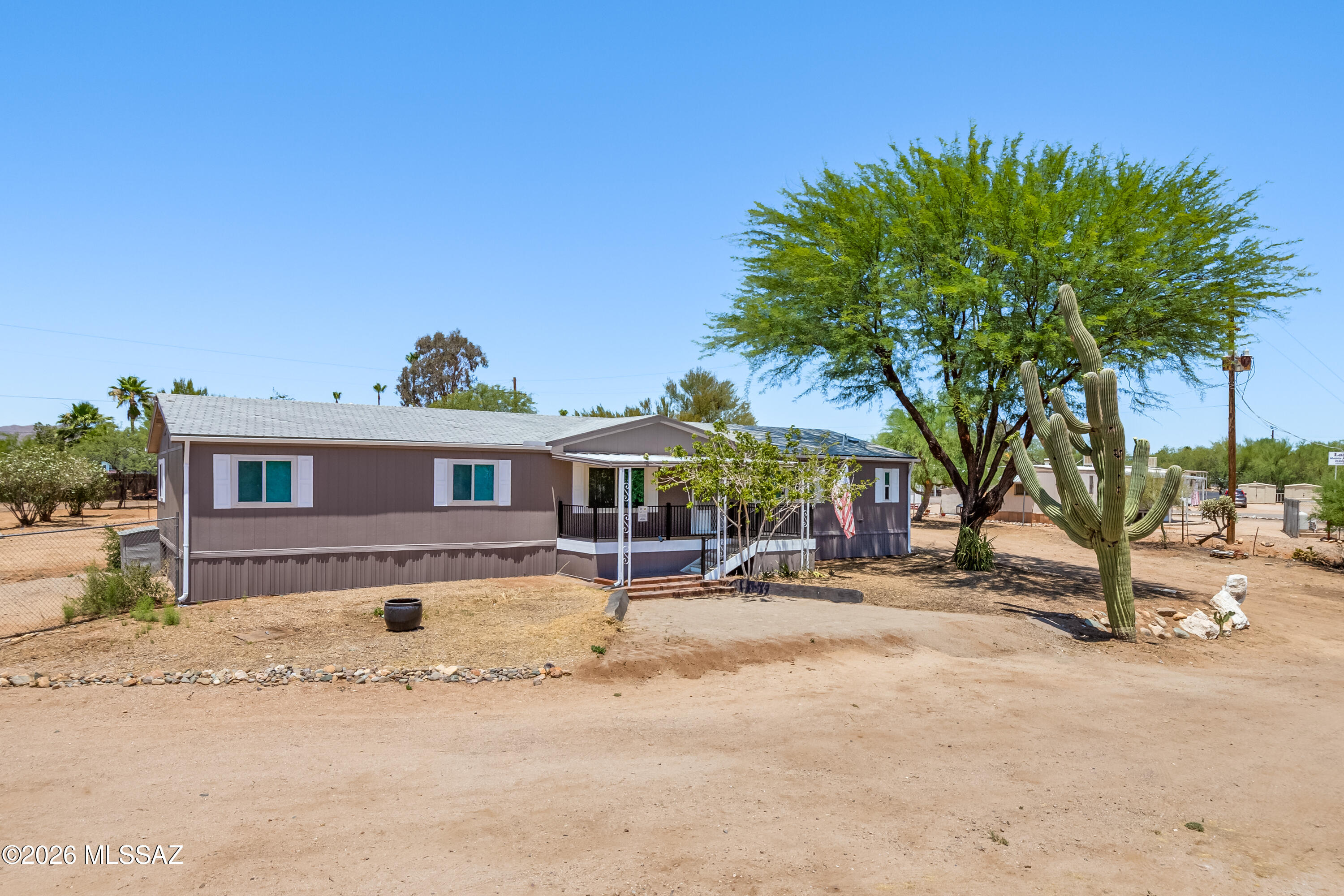 Beautiful unobstructed Catalina Mountain Views, Manufactured Home on 1.16 acres with 4 Bedroom, 2 Bathrooms, Open Great Room off Kitchen. Lots of Outdoor Space with Storage Shed / Rec Room.