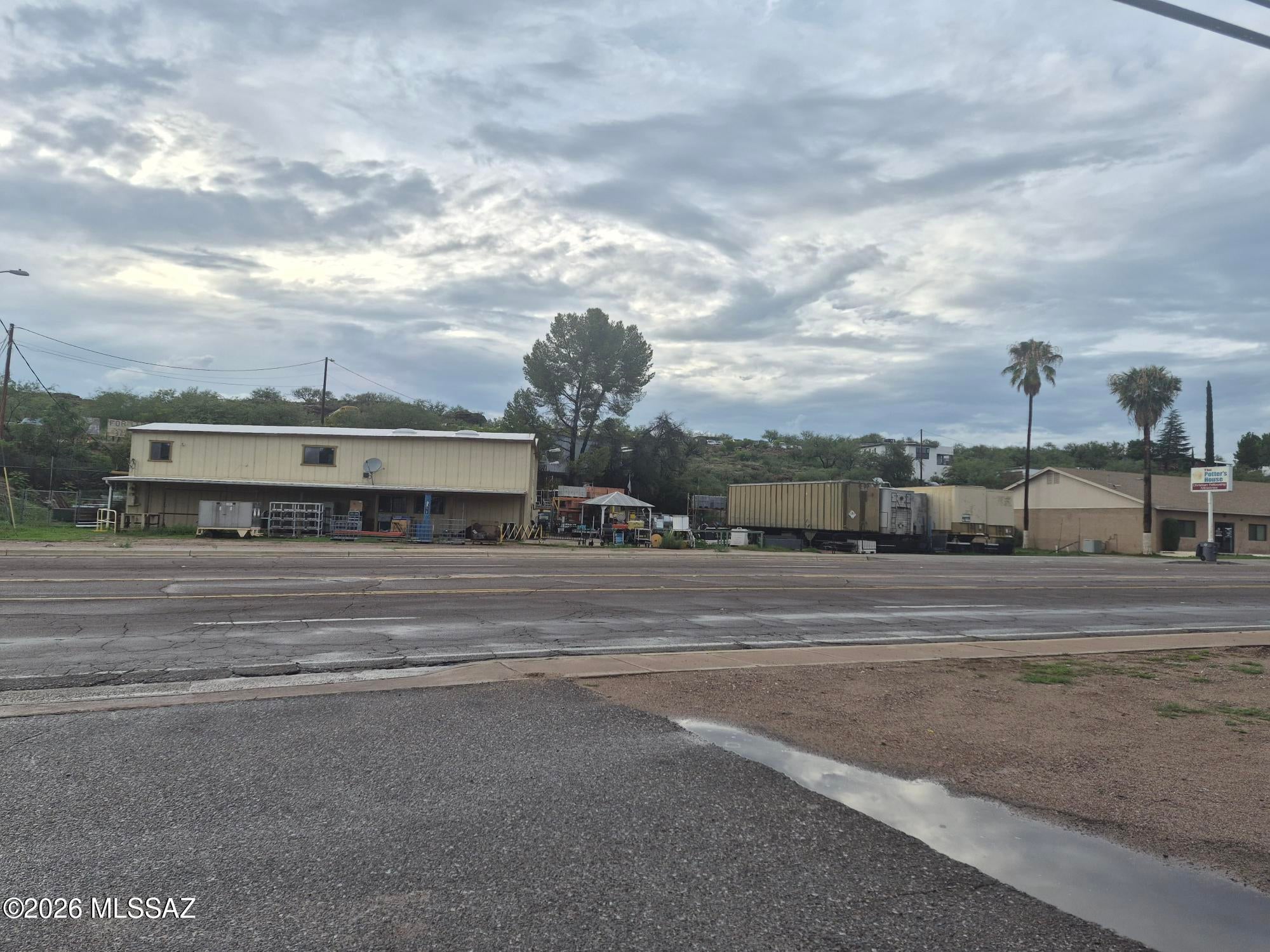 Great Investment opportunity to own your own business, with lots of frontage with visibility .Zoned Industrial,  present use as commercial store called Surplus World.  All inventory stays with the sale including trailers on site.  Seller will sell the property with the inventory for $475,000.00. Seller will finance with downpayment.