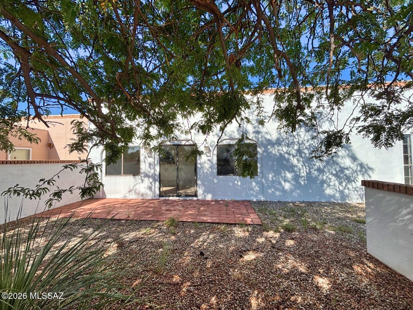 Enjoy the sunrise from your shady courtyard! Lots of square footage plus a large Arizona Room on this Townhouse in Pearce/Sunsites. There is a large shade tree at the East side courtyard plus a large covered patio on the West side. Center unit for lower utility bills. Cozy Wood burning fireplace in the living room for winter. Attached carport to keep your vehicle out of the sun with attached storage room. Roof just Professionally Recoated with a 3 yr warranty. No HOA. Fiber optic internet available. Paved streets. Hope Water company for water and sewer. Large kitchen with 2 pantries. Split bedroom floor plan for privacy.