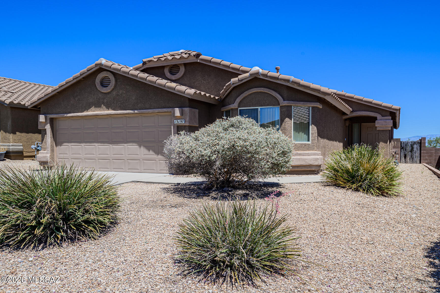 Come see and plan your future in this spacious 1561 Sq Ft, 3 bed/2 bath plus den/office gem in the desirable Vail School District! The open floorplan has a kitchen island, all kitchen appliances and a cozy fireplace. Enjoy a great backyard with covered patio and mountain views! Tasteful carpet, tile, front landscaping and spacious 2 car garage round out this home and it is priced to sell.