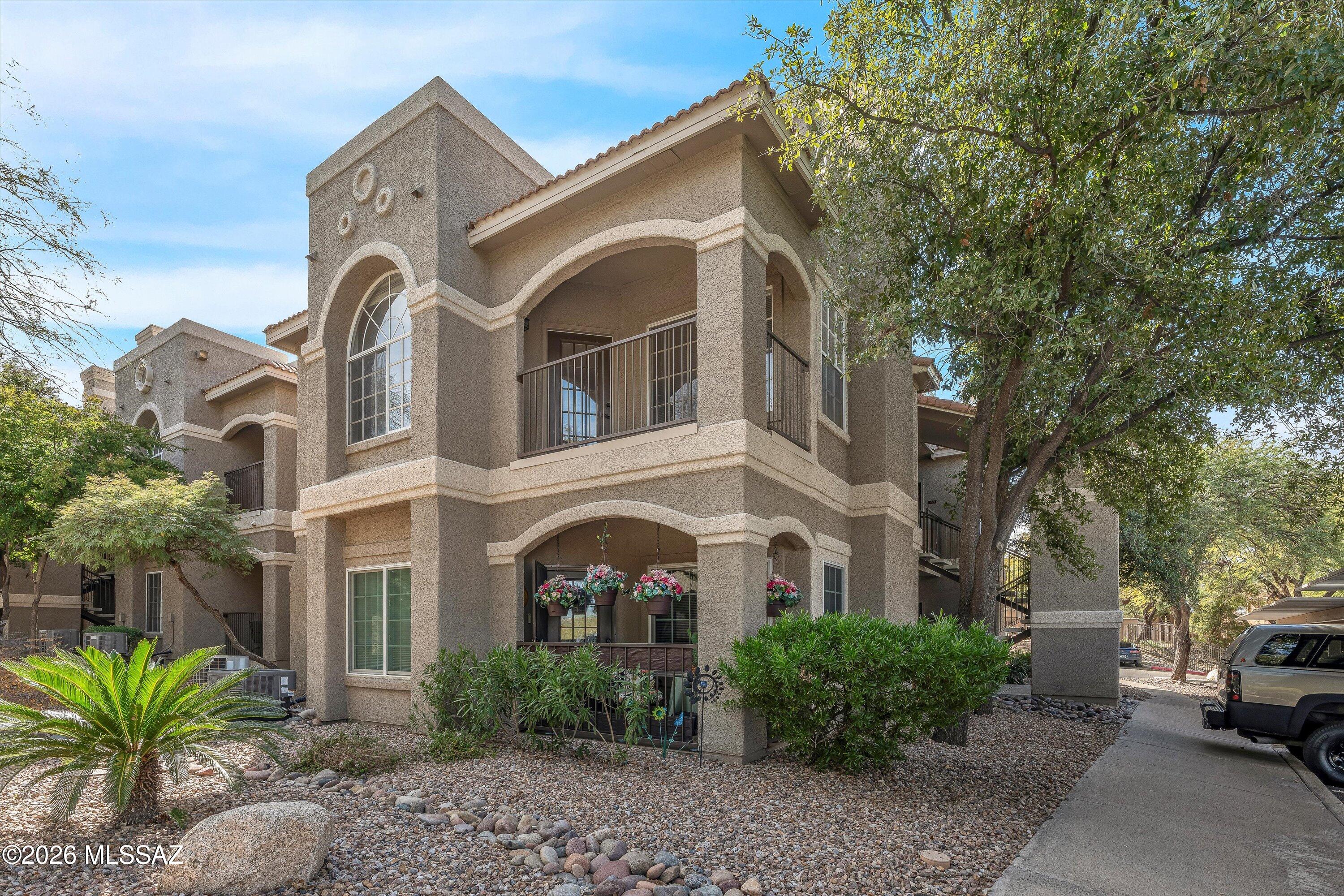 Discover the perfect blend of comfort and convenience in this beautifully maintained 2-bedroom, 2-bath condominium located in the desirable Boulder Canyon at La Reserve community. Ideally situated in Oro Valley, this home offers easy access to the community center, sparkling pool, relaxing spa, and all the amenities the area has to offer.
Step inside to a welcoming foyer that flows seamlessly into the spacious living room, featuring a cozy fireplace, elegant laminate flooring, and a ceiling fan for year-round comfort. Enjoy dining or relaxing on the charming covered balcony just off the dining area, surrounded by mature trees and lush landscaping.
The efficient kitchen is designed for functionality, with tile floors and counters, a pantry cabinet, and all appliances included for your convenience. A dedicated closet houses the washer, dryer, and hot water tank, maximizing space and organization.
Both bedrooms are generously sized and feature large walk-in closets, providing ample storage. The hall bath offers a tub and tiled flooring, while the primary suite includes its own full bath with tub and tile accents.
Residents enjoy a comprehensive association fee that covers access to the pool, spa, community center, exercise facilities, fire protection, refuse collection, structural hazard insurance, roof repair, sewer lines, and common area maintenanceensuring a low-maintenance lifestyle and exceptional value.
Experience comfortable living in a prime locationschedule your private tour today!