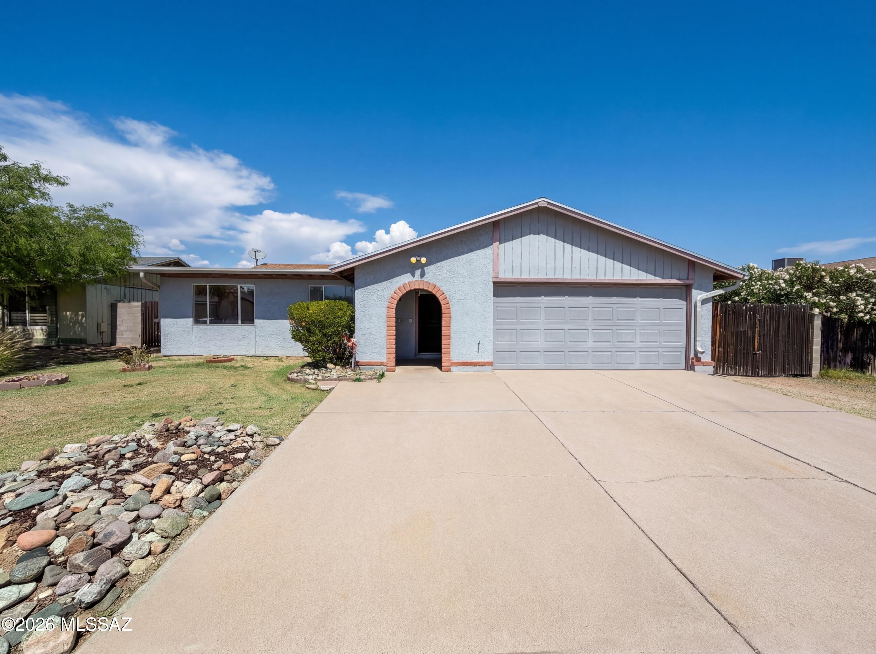 Come see 9941 E Hawthorne St, recently refreshed with fresh interior paint throughout and a kitchen that includes stainless steel appliances and an accent backsplash. The residence contains a fireplace and the primary bedroom is equipped with double closets, enhancing storage capability. An exterior patio connects to a fenced in backyard, which contains a storage shed for practical use. This home is a perfect blend of style and functionality. Don't miss out on this gem! Included 100-Day Home Warranty with buyer activation