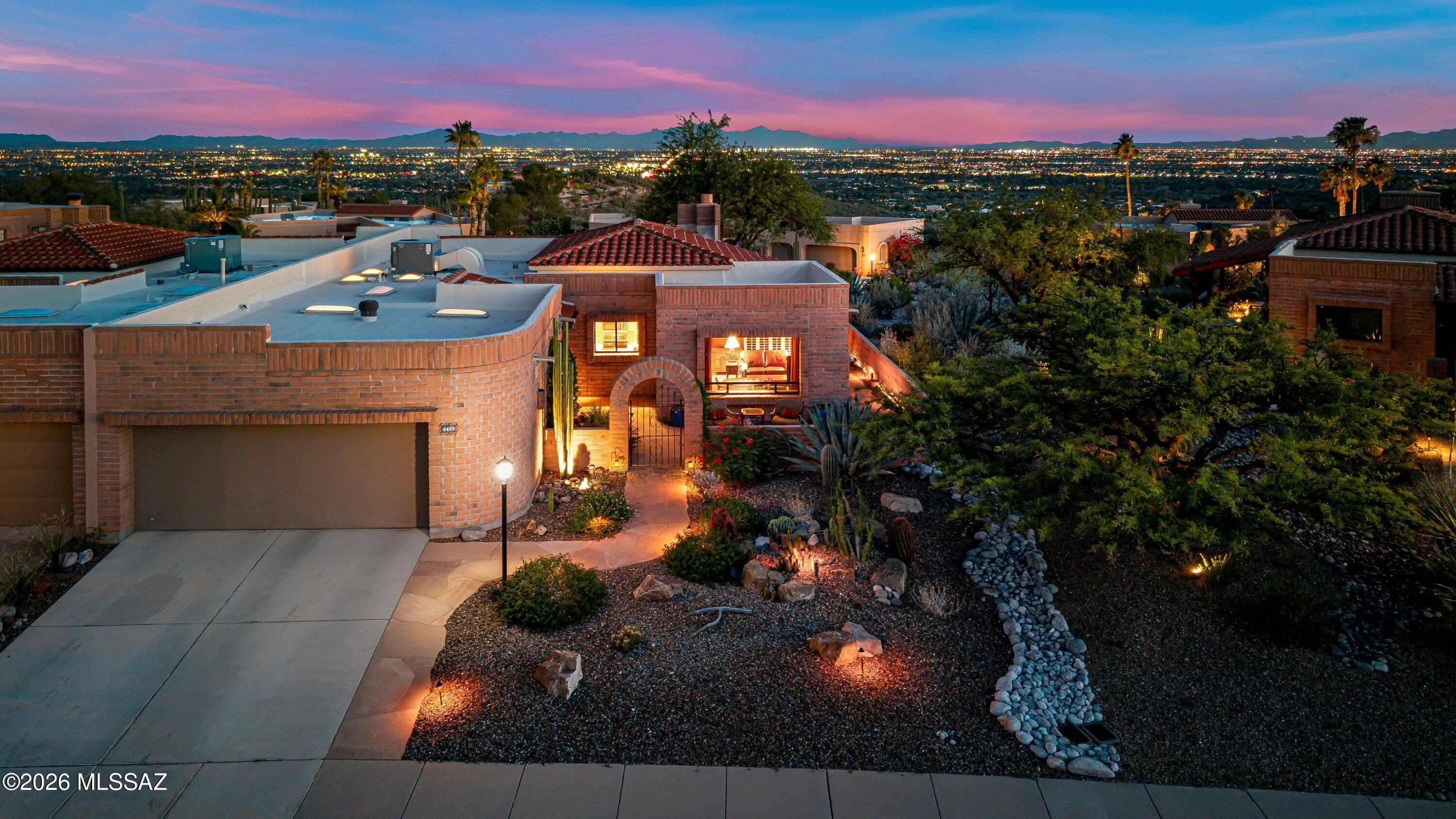 Experience the beauty of Fairfield in the Foothills, a highly coveted community nestled against the Catalina Mountains, This ridgetop home offers gorgeous sunsets, city lights, and mountain views. Natural desert borders one side, offering exceptional privacy. Wrap-around patios. Thoughtfully designed landscaping showcases striking native cacti, meyer lemon tree. Enter through charming courtyard. Living area with high ceiling and cozy fireplace. Updated kitchen with custom cabinets. Extended area off kitchen, Ceramic tile throughout. Community offers 2 pools, spas, tennis/pickleball courts, & bocce ball. Close to shopping, restaurants, hiking and more. Welcome home to Fairfield in the Foothills.