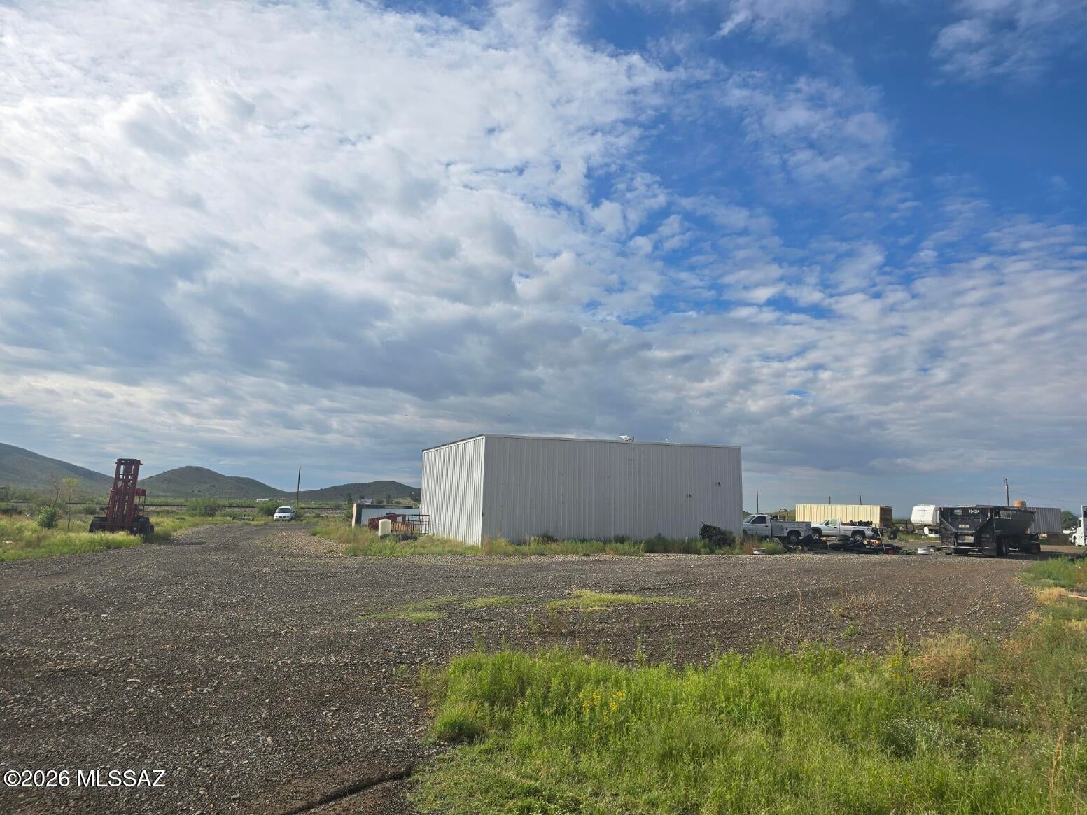 This 2.06-acre commercial property features a versatile Quonset hut, a private well, an on-site septic system, and an income-generating billboard bringing in $5,000 per year. It offers a rare mix of functional industrial space and passive income in a prime location. Property