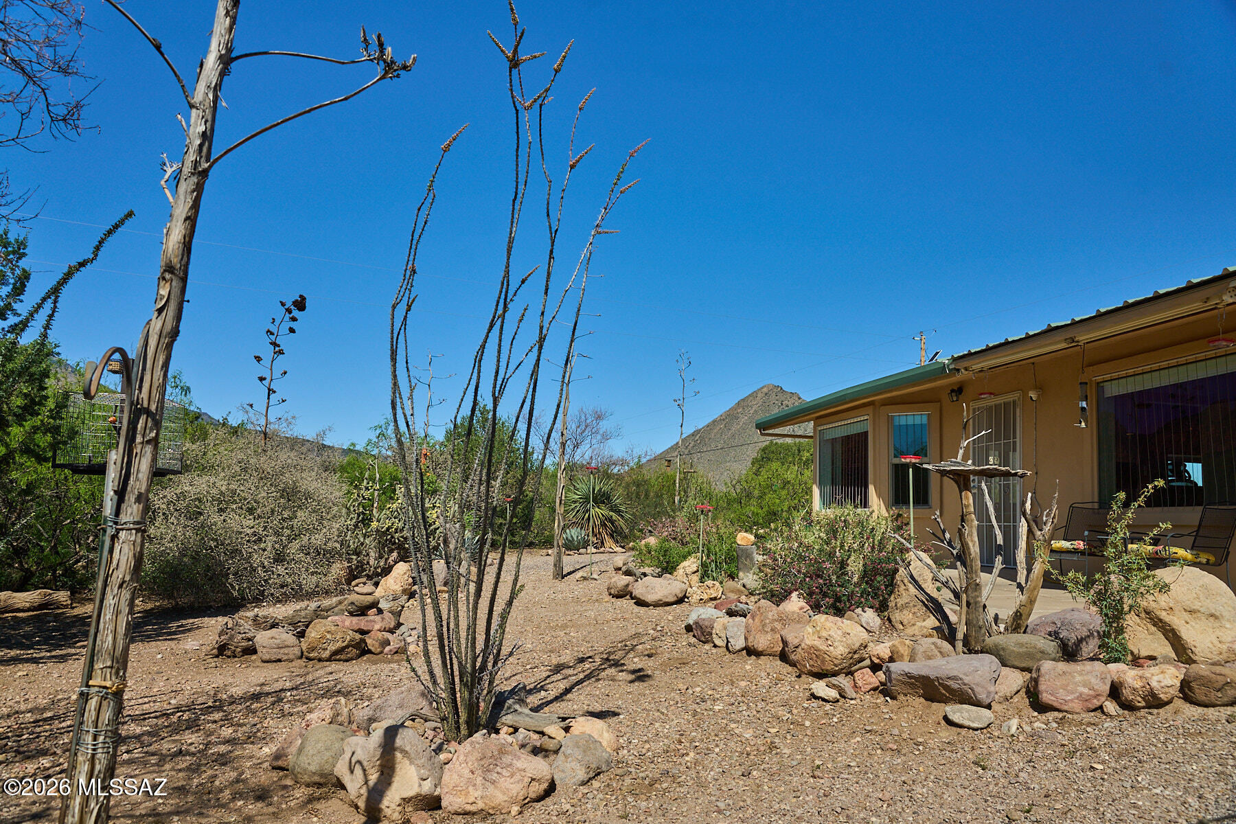 Move-in ready 2 bed, 1 bath home on 4.3 acres with stunning
mountain views is just a short walk to downtown Portal. Built to
last in 2010 with durable Structural Insulated Panel construction
and metal roof. Thoughtfully updated in 2023 along with a kitchen
and bathroom remodel with additional lighting, new appliances,
cabinetry and kitchen island offering additional
workspace/storage, along with fresh paint throughout. Spacious
great room, primary suite, and 2 nd bedroom feature cathedral
ceilings with exposed beams. Energy-efficient windows and mini-
split units for heating and cooling mean you will always be
comfortable. Enjoy birding from your own yard with feeding
stations, water feature, and shaded porches. Includes private
well, insulated metal outbuilding with carport, s