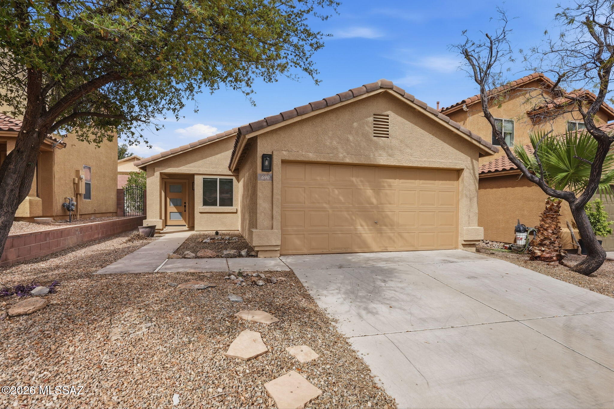 Tucked into the welcoming community of Los Arroyos, this thoughtfully renovated home offers the kind of fresh start every buyer hopes to find--where the work is already done, and the next chapter is yours to write.

Step inside and feel the difference immediately. New wood plank tile flooring stretches seamlessly throughout, grounded by fresh interior paint that brightens every corner. The heart of the home--the kitchen--has been completely reimagined with crisp white cabinetry, sleek quartz countertops, new hardware, and a modern sink & faucet. A full suite of new Samsung stainless steel appliances stands ready for everything from weeknight dinners to weekend gatherings, while the spacious pantry keeps life organized behind the scenes. Every detail has been considered. Crown molding add a refined touch, while new custom light fixtures and LED ceiling fans bring both style and efficiency. Brand-new dual flush toilets, updated blinds, and a new HVAC system under warranty provide peace of mind where it matters most. Even the front door makes a statement--custom designed with obscure glass that welcomes in natural light while preserving your privacy. Out back, the yard is a blank canvas--ready for a garden, a patio, or that desert retreat you've been dreaming about. Mature landscaping in the front has already been refreshed, offering instant curb appeal with room to grow.

Set in a neighborhood designed for connection and play, you'll enjoy access to a community dog park, a playground, and basketball court--perfect for active days close to home. With shopping, dining, and everyday conveniences just minutes away, this location balances comfort with convenience.

Clean, updated, and move-in ready--this is the kind of home that doesn't sit still for long.