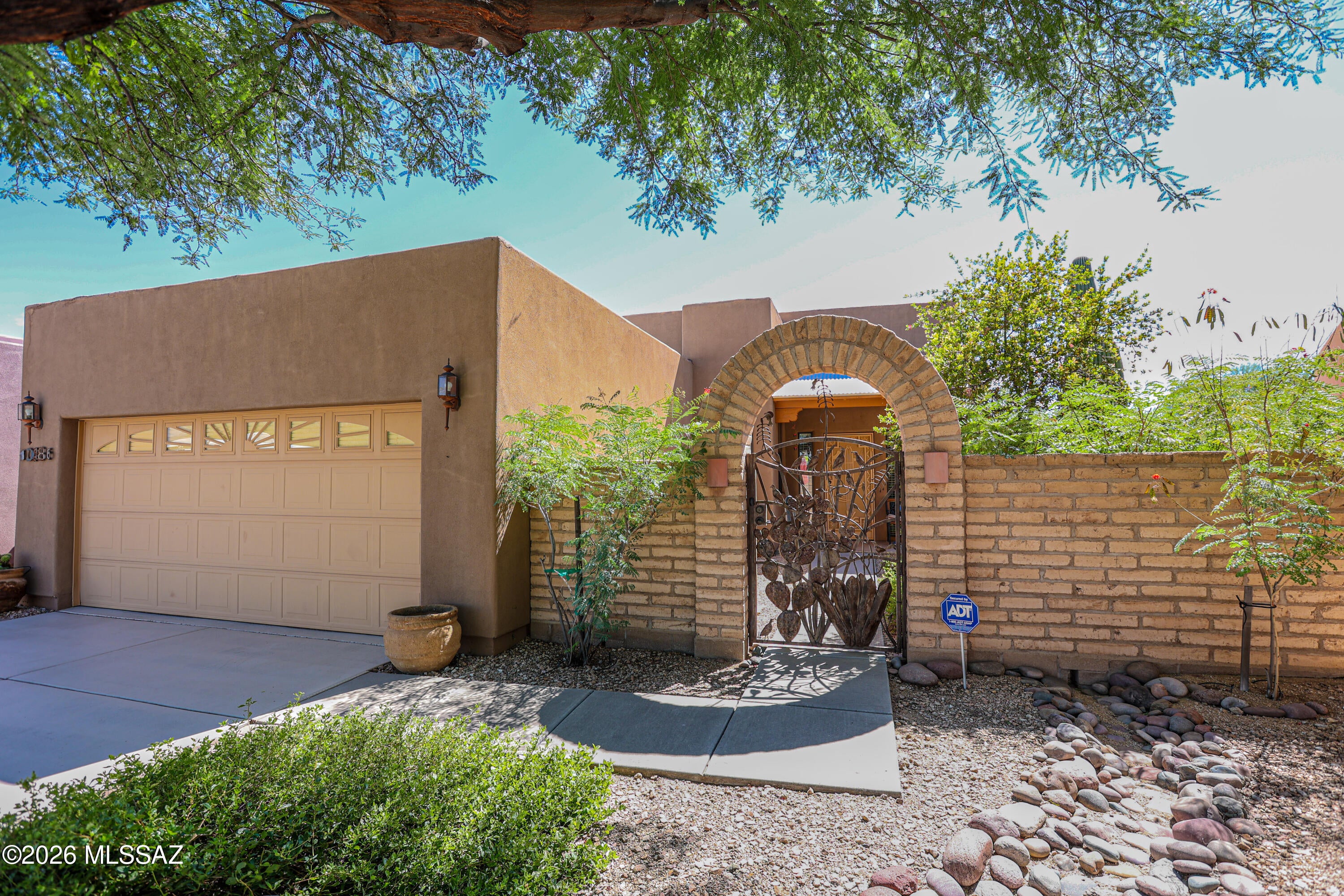 Assumable loan at 6.25% with a potentially low down payment - ask for details (can be assumed by non veteran, also).  Charming Southwestern-style home in desirable Barrio Rincon, built by Miramonte Homes situated on a quiet cul-de-sac. Offering 1,601 sq. ft., 3 bedrooms and 2 baths, this home features a desirable split-bedroom floor plan and a spacious great room accented by clerestory windows that bring in beautiful natural light. The kitchen features granite countertops, a center island and plenty of workspace for everyday living and entertaining. Step outside to your own desert retreat with mature desert vegetation, a sparkling pool with waterfall, covered patio and beautiful views of the Rincon Mountains. The backyard backs to common area, adding privacy & a personal private setting Additional features include a welcoming front courtyard, custom security door, newer HVAC, newer Water Heater, soft water loop and garage cabinets for extra storage. Conveniently located near shopping, schools, restaurants and a movie theater. Built in 2004, this Barrio Rincon home offers a wonderful opportunity to enjoy Southwestern living, Rincon Mountain views and a private backyard oasis.