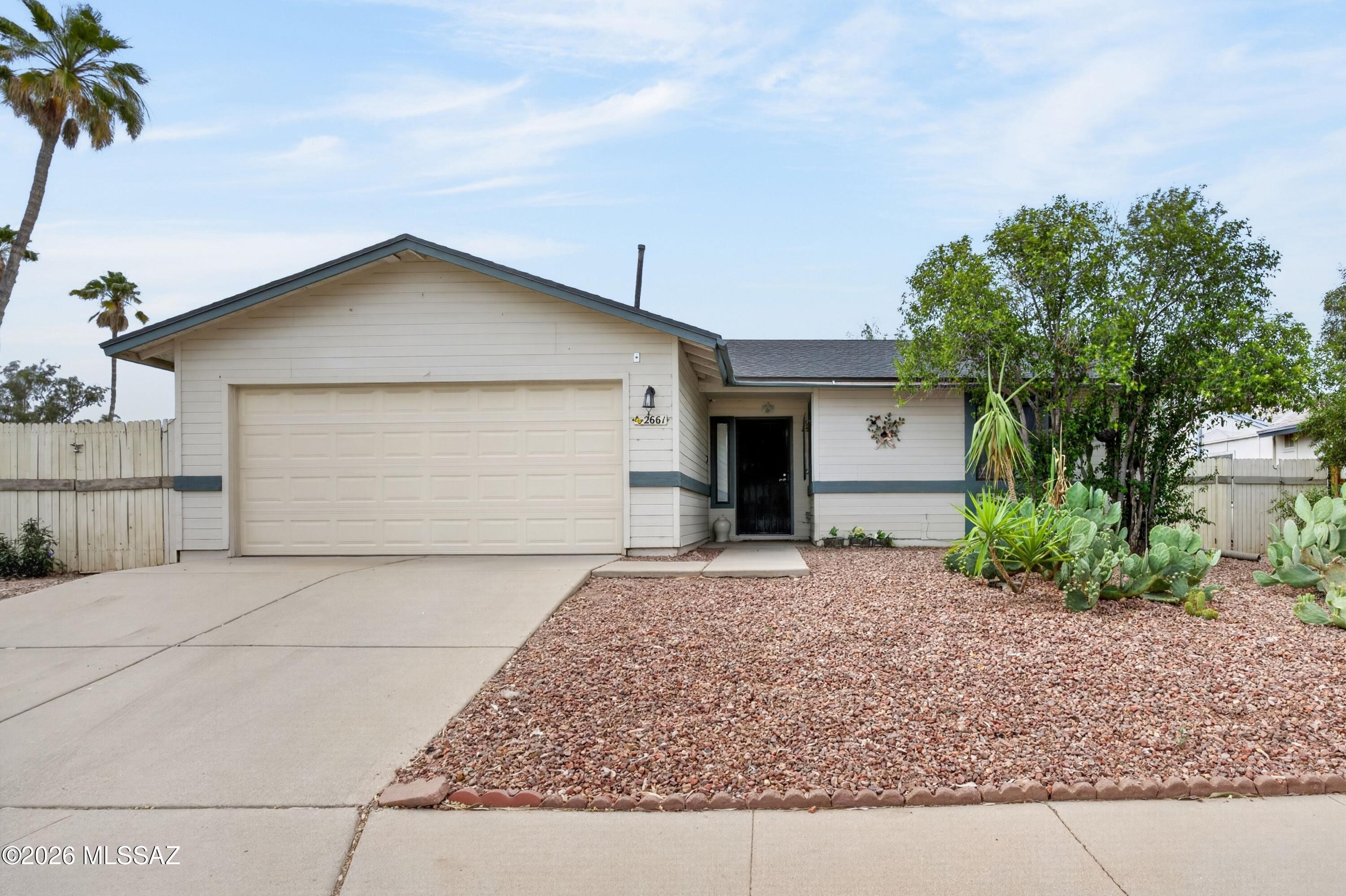 Welcome to a beautifully reimagined residence that effortlessly blends modern updates, low-maintenance living, and an exceptional location-creating a home that truly checks all the boxes for today's discerning buyer. Perfectly positioned on a desirable end lot, this thoughtfully upgraded 3-bedroom, 2-bathroom home offers enhanced privacy while placing you just steps from the community pool, delivering a resort-style lifestyle right outside your door. From the moment you arrive, you'll appreciate the pride of ownership and meticulous care that defines this property. Step inside to discover a light-filled interior enhanced by all-new laminate flooring throughout-yes, absolutely no carpet-providing a clean, cohesive look that is both stylish and incredibly easy to maintain. Fresh interior paint further elevates the space, creating a bright, inviting atmosphere that feels truly move-in ready. The heart of the home--the kitchen--has been tastefully updated with both functionality and charm in mind. Enjoy the convenience of a roll-out pantry for effortless organization, while a picturesque bay window fills the space with natural light. A custom built-in hutch with accent lighting adds a touch of elegance and offers the perfect setting for displaying serveware or hosting guests, making this kitchen as ideal for entertaining as it is for everyday living. Retreat to the spacious primary suite, where comfort meets luxury. The fully remodeled en-suite bathroom is a standout feature, showcasing dual vanities, a dedicated makeup station, and stunning floor-to-ceiling tile work that creates a spa-like experience you'll appreciate daily. Every detail has been carefully curated to provide both beauty and functionality. Additional highlights include a newer roof for added peace of mind and a low-maintenance yard, allowing you to spend more time enjoying your home and less time on upkeep. Whether you're relaxing indoors or taking advantage of the nearby community amenities, this home is designed for effortless living. Location is everything--and this home delivers. Ideally situated just minutes from the vibrant Orange Grove corridor, you'll have convenient access to everyday essentials and top retailers including Costco, Home Depot, Sprouts, and a variety of dining options. Outdoor enthusiasts will love the proximity to the Rillito River Loop, perfect for biking, walking, or enjoying Tucson's beautiful weather, as well as easy access to the base of the Catalina Foothills. Immaculately maintained, tastefully updated, and perfectly located--this is a rare opportunity to own a home that offers both lifestyle and value. Homes like this don't last long--schedule your private showing today and experience all that this exceptional property has to offer.