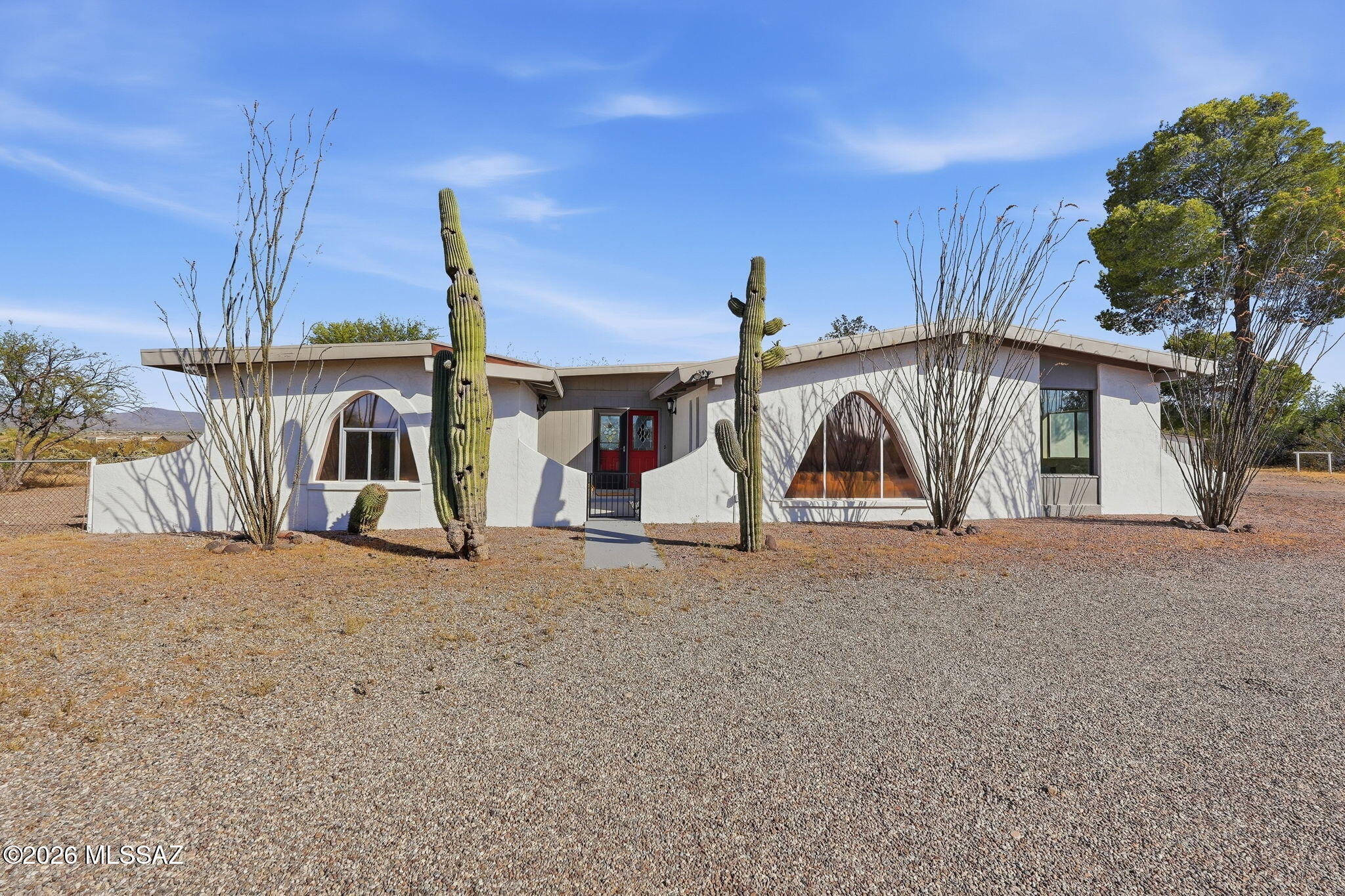 Rare opportunity in Rocking K Ranch Estates with three parcels included totaling approximately 2.32 usable acres. Enjoy Southern Arizona living with existing horse facilities already in place. With no HOA, panoramic Rincon and Santa Catalina Mountain views, and one of the uppermost lots in the neighborhood, this quiet cul-de-sac property offers privacy, space, and flexibility for all your needs. The spacious 2,800+ sq ft home features generous bedrooms, an updated kitchen w Cambria Quartz countertops, family room, formal dining room, formal living room, and a finished Arizona room ideal for entertaining, office, game room, or media space. Plenty of room for on the lot for all the toys. Located in the top-rated Vail School District. New roof in 2025 with warranty for buyer