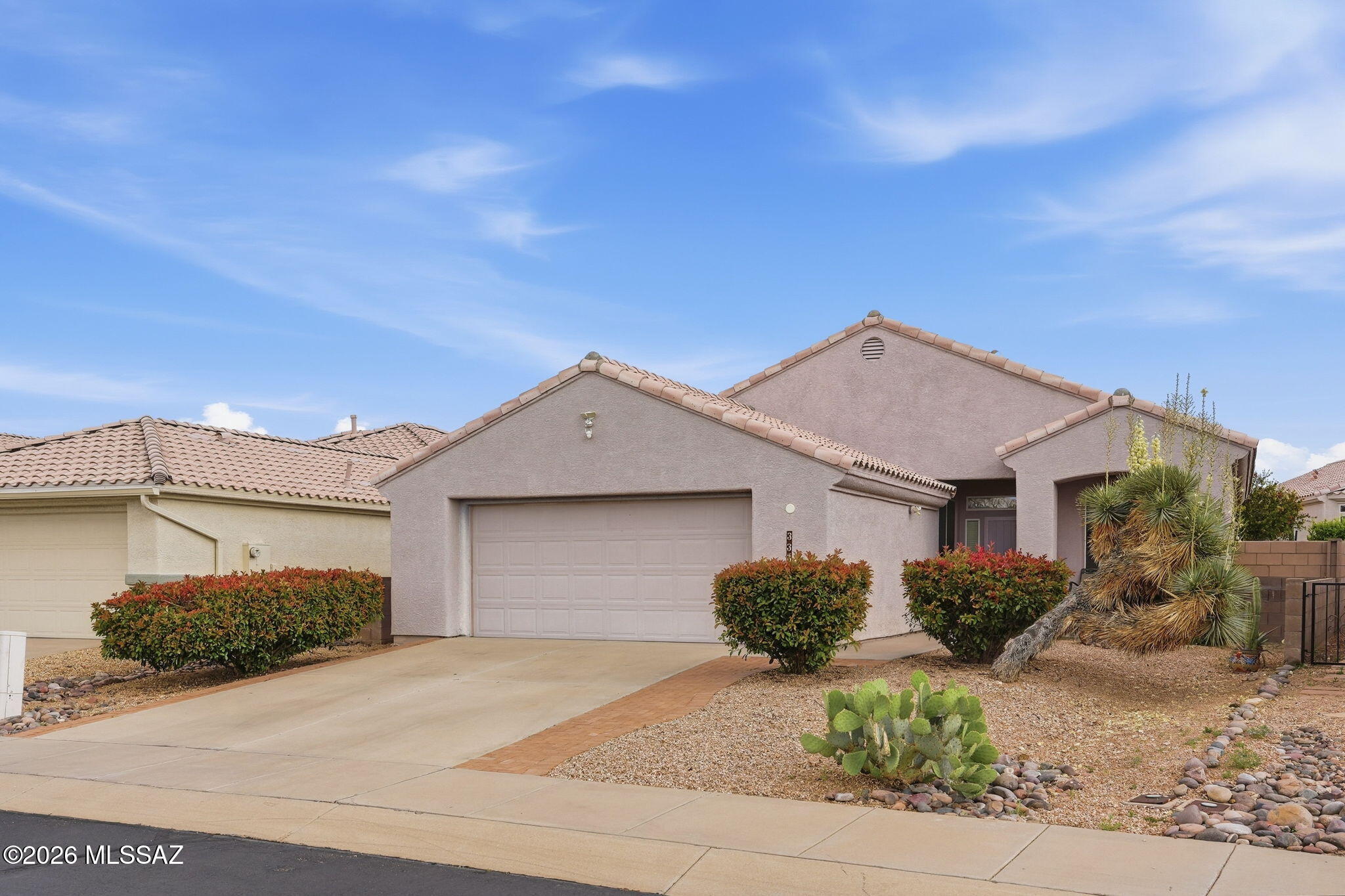 Discover easy Southwest living in this charming 2-bedroom, 2-bath home nestled in a quiet cul-de-sac within a desirable 55+ community with GVR and HOA amenities. Designed for both comfort and functionality, the popular great room floor plan offers an inviting living and dining space with tile flooring throughout the main living areas and comfortable carpet in the bedrooms.

In addition to two spacious bedrooms, the home features a versatile den and a dedicated sewing or hobby room, providing flexible space for crafts, hobbies, a home office, or additional guest accommodations. The kitchen and living areas flow seamlessly for both everyday living and entertaining. Step outside and enjoy the low-maintenance desert landscaping with native trees, shrubs, and decorative gravel, creating a peaceful outdoor setting with minimal upkeep. The attached 2-car garage adds convenience and storage.

Whether you are looking for a full-time residence or a seasonal retreat, this home offers the ideal blend of comfort, flexibility, and access to all the recreation, social activities, and amenities that Green Valley Recreation has to offer.