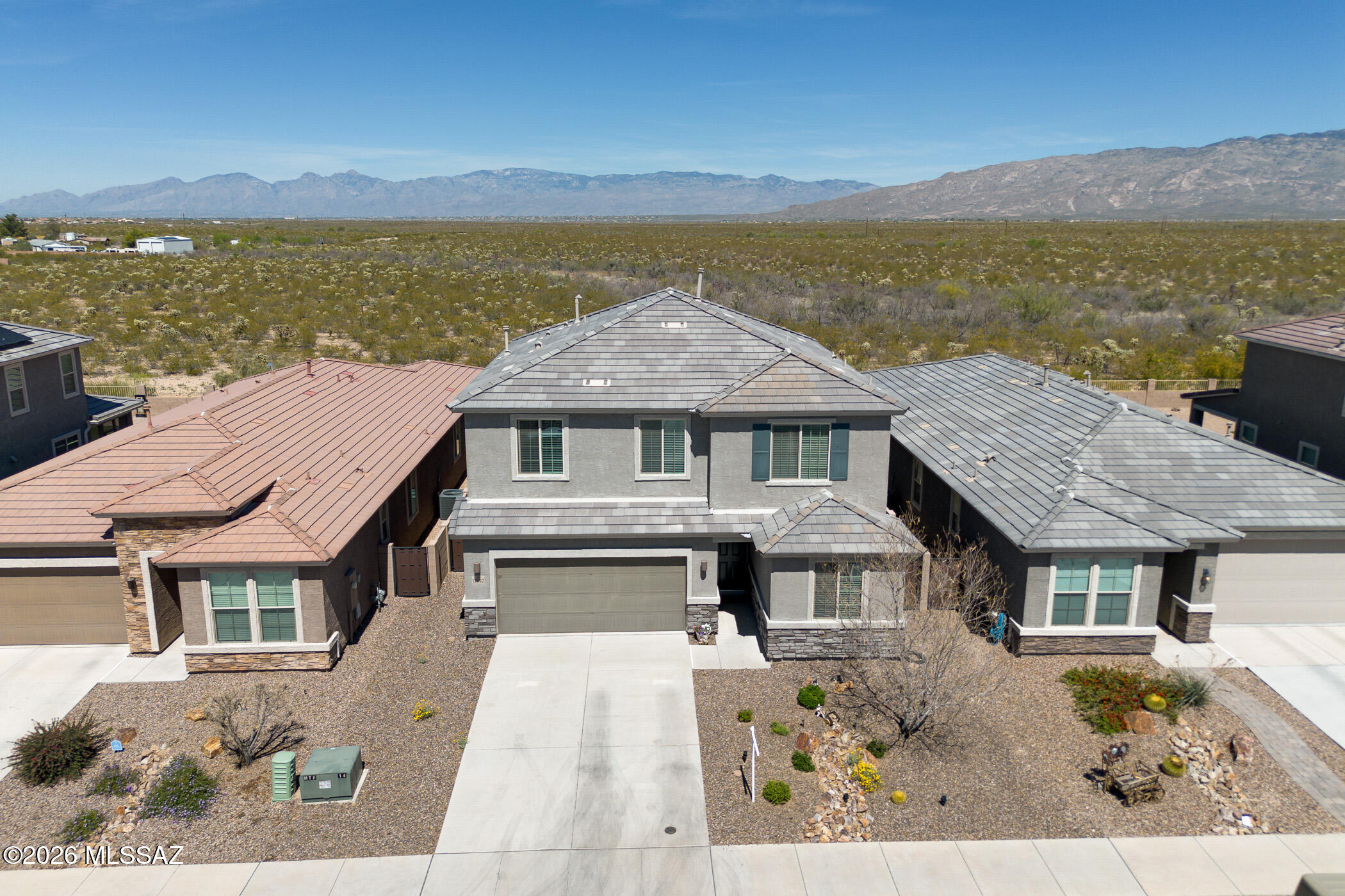 3.878%  VA Assumable loan, potentially available with lender approval. Welcome to this stunning Newer Construction home, built in 2022. 4 bedroom, 3 bath home with loft. including a convenient downstairs bedroom--perfect for guests or multi-generational living. As you enter, you're greeted by a spacious foyer that sets the tone for the open and inviting layout. The formal dining area flows seamlessly into a beautiful gourmet kitchen complete with white cabinetry, granite countertops, and modern finishes--ideal for entertaining. The living area is open, bright, and expansive, featuring wood-plank tile flooring that adds both style and durability. The primary suite is truly a retreat, highlighted by large windows that frame breathtaking Views of both Catalina and the Rincon mountain views. The ensuite bathroom is thoughtfully designed with dual sinks, a fully tiled walk-in shower, a spacious walk-in closet, and a stylish barn door. Upstairs, you will find a fully carpeted level with large loft- idea for tv area or playroom. The oversized laundry room offers exceptional functionality along with a bonus area for additional storage. The guest bathroom features a convenient shower/tub combination, with two additional bedrooms that provide comfort and flexibility for family or guests. Step outside to the backyard, Enjoy sweeping head-on views of Catalina and Rincon Mountains- no angled or partial views here, just stunning unobstructed desert beauty. Enjoy several parks, in the community, location In the mac Community subdivision in Vail has, easy access to shopping and the I-10 corridor.