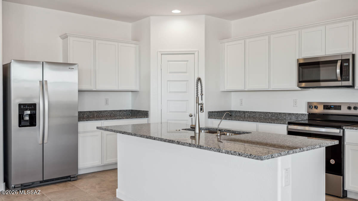 Welcome to your dream home in the desirable Saguaro Bloom community! This beautifully designed single-story home offers 5 generously sized bedrooms and 3 full bathrooms, perfect for families or those seeking extra space for guests or a home office. The open concept split floorplan features a bright and airy great room that seamlessly connects to the modern kitchen, complete with quartz countertops, stainless steel appliances, a large kitchen island and walk in pantry. Includes a three-car garage and is our most energy efficient home featuring spray foam insulation and is zero energy ready! Don't miss your chance to tour this amazing home!