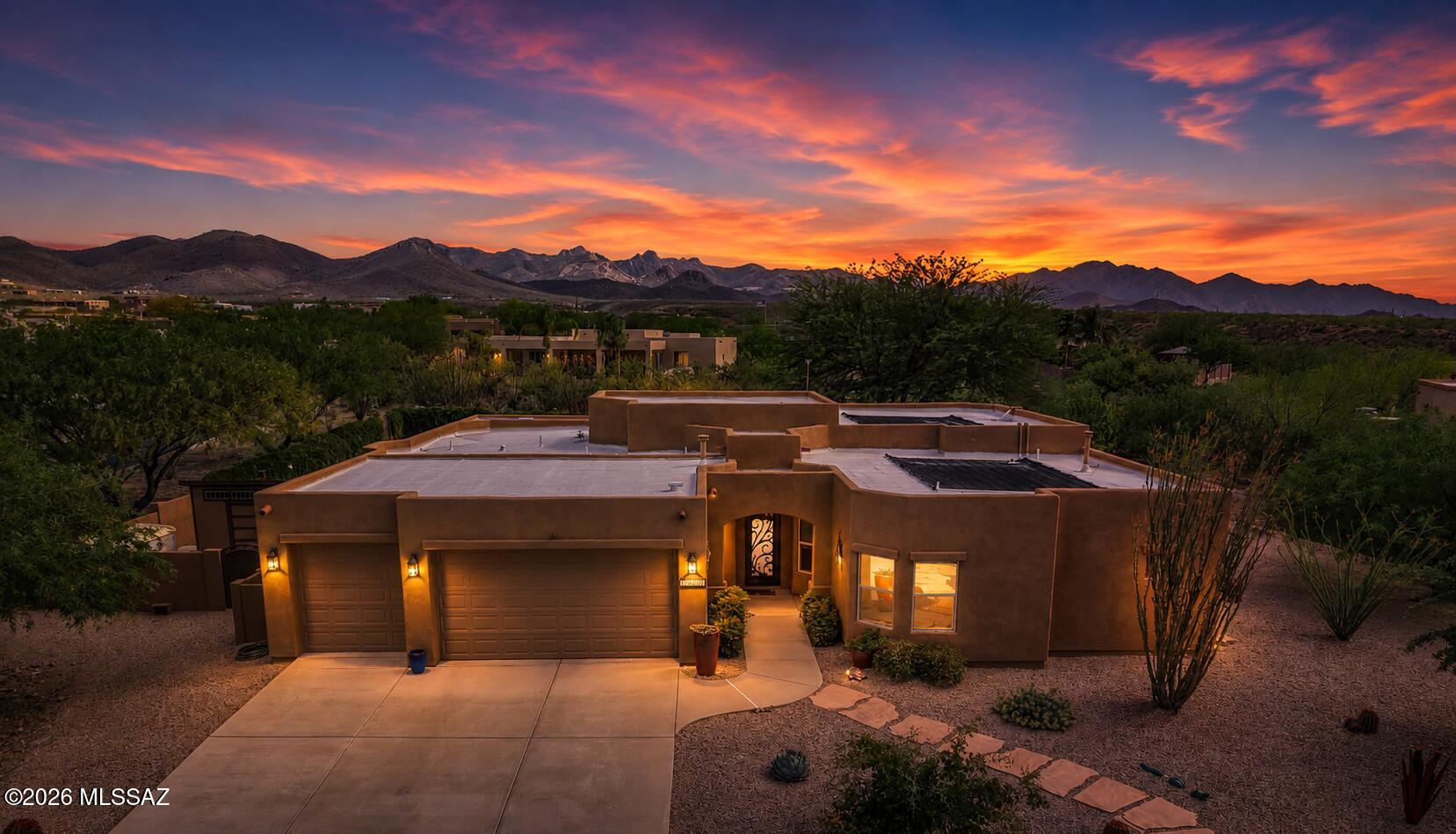 This stunning Sombra home features 4 bedrooms, 3 baths, 2603 SQFT on .74 acre lot in the desirable Vail area within the award-winning Vail school District. Built with durable 2x6 construction, this move-in ready home offers a custom iron front door, and an open light-filled floor plan. Interior highlights include solid wood cherry Merillat cabinetry, Bali insulated window blinds, ceiling fans throughout, and new porcelain tile in the primary bedroom, closet, and office. Bedrooms 2 and 3 offer newer carpet. Bedroom 2 has its own private bathroom. The home is equipped with a dual HVAC systems and a fire sprinkler suppression system for added efficiency and peace of mind. All three bathrooms have been upgraded with new granite countertops, updated sinks and faucets, and a granite surround in the primary bath, along with a heated towel rack and additional matching fixtures throughout. New GE washer and dryer. The expansive backyard is designed for both relaxation and entertaining, featuring professional xeriscaping, terraced landscaping with mature trees, real grass, and a private pool with solar heating. Enjoy a ramada, designated lighted BBQ area, app-controlled fountain, and professional outdoor lighting. The space is enhanced with wired Bose outdoor speakers with volume controls and four rechargeable, color-changing pool lights. Additional features include a 3-car garage with its own AC unit, three storage sheds, a wall/roof-mounted weather station, and a 50 amp RV outlet.