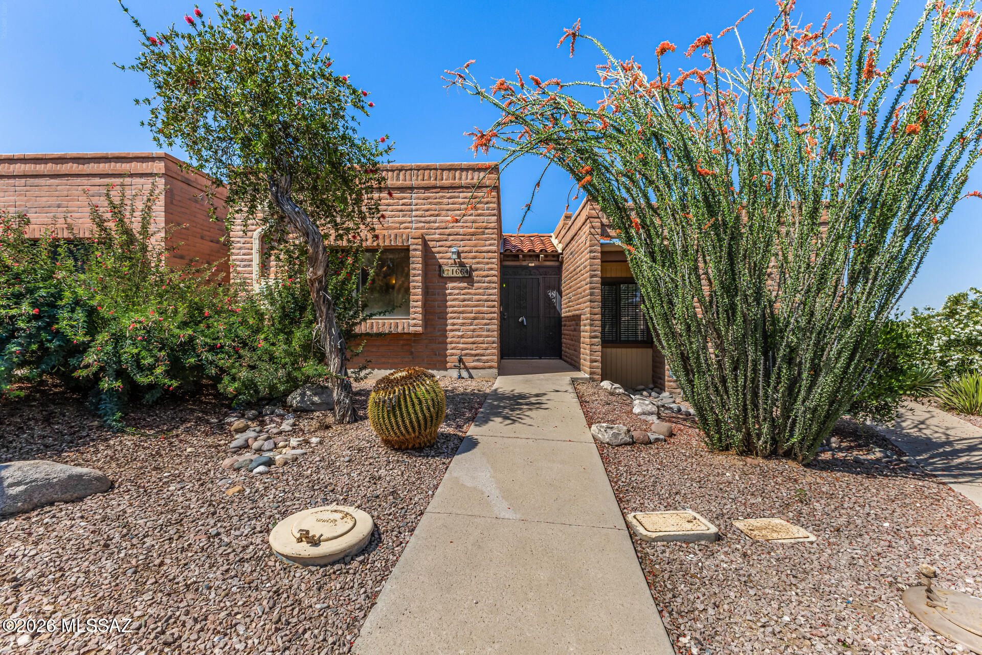 Welcome to this charming townhome in the active adult 55+ community of La Cholla Hills. Open and inviting great room floor plan with great space, contemporary track lighting, a mirrored wall, and durable tile flooring for easy maintenance. The well-appointed kitchen comes with ample wood cabinetry, essential built-in appliances, a pantry, and a pass-through with a breakfast bar for casual meals. Both bedrooms are cozy and well-sized. Enjoy the back patio offering breathtaking views of the distant mountains and privacy. The Community boasts shuffleboard and tennis courts, a refreshing spa and pool, a recreation center, and many more!
