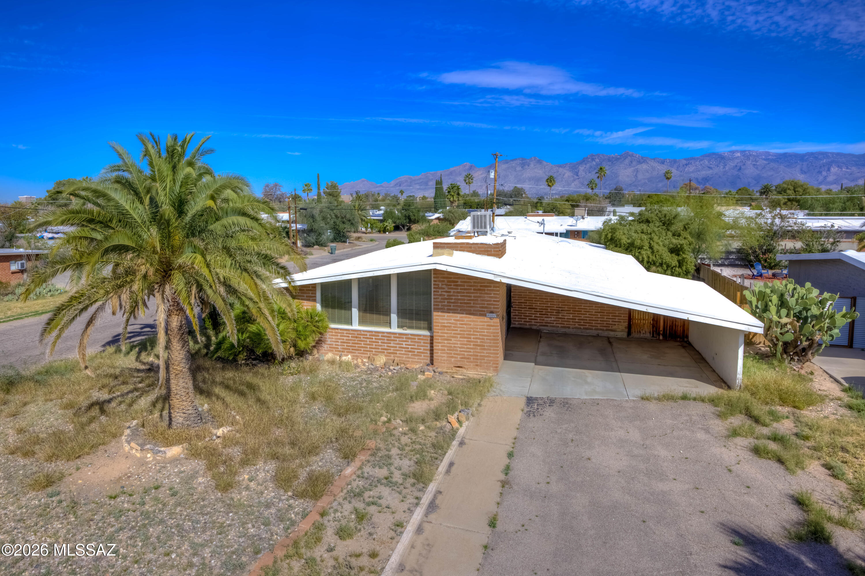 Burnt adobe 4-bedroom, 2-bath home on a large corner lot. Interior is in solid condition with a functional layout and good bones, while the spacious yard could use some attention and offers room to add value. Covered patio and plenty of outdoor space. Terrific opportunity close to Davis-Monthan AFB, medical, shopping, and everyday conveniences.