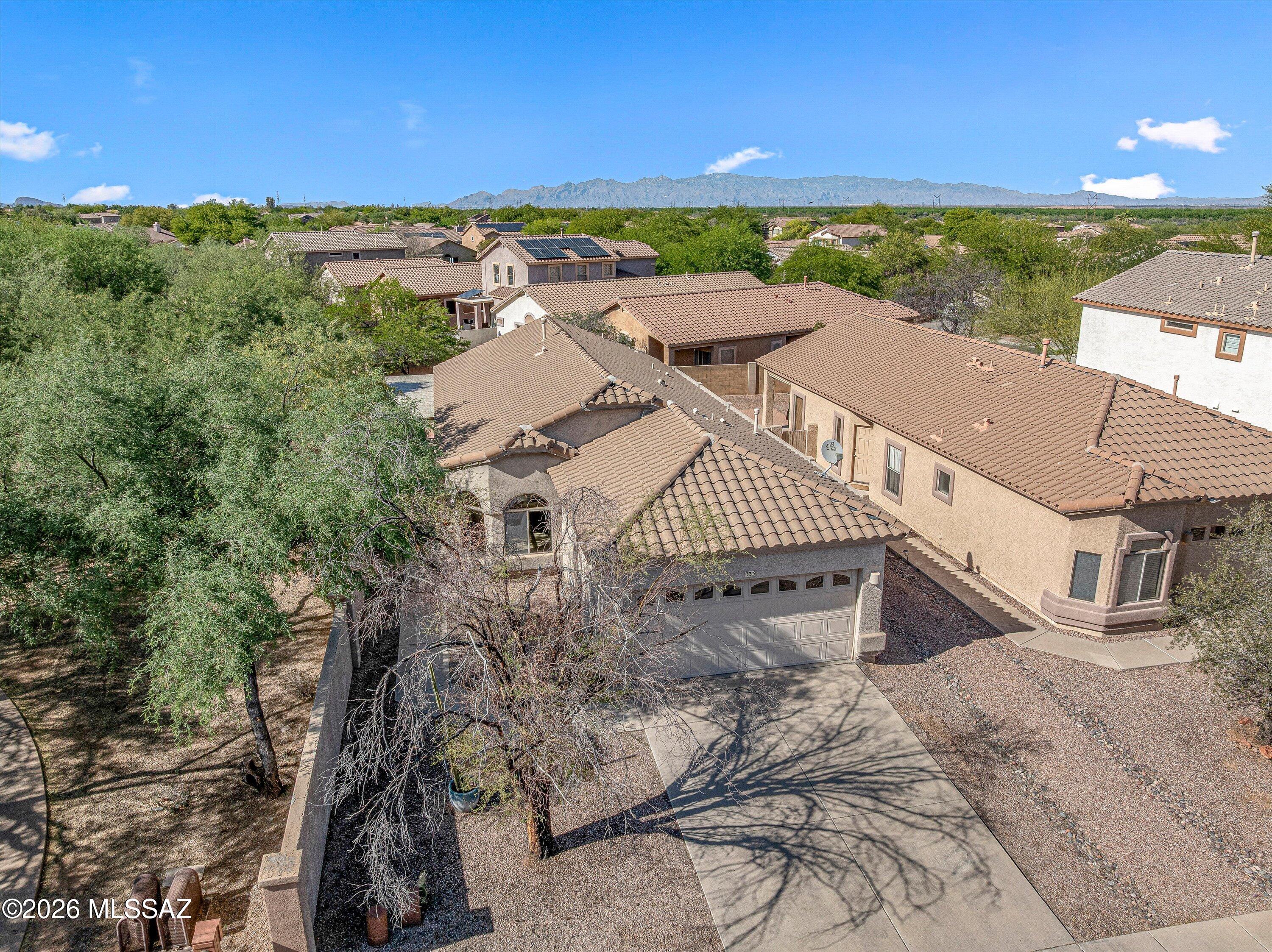 Charming single-story 3-bedroom, 2-bath home just one block from Sahuarita Lake in the Rancho Sahuarita master-planned community. Ideally located near the clubhouse and trails, this home welcomes you with soaring ceilings and abundant natural light. The kitchen features a pantry closet, ample cabinetry, and generous counter space.  Newer microwave and dishwasher (2025) stove (2022). Washer and dryer (2025) The spacious living room accommodates plenty of comfortable furniture.  The primary suite offers vaulted ceilings, a walk-in closet, and a walk-in shower. Two guest bedrooms share a full bath with a relaxing jetted tub. Additional highlights: HVAC 2020, hot water heater 2021, newer front door 2024. Rancho Sahuarita is a vibrant community with top-rated schools, multiple pools/spas, a gym, and miles of walking trails, plus easy access to shopping, dining, and I-19 for a convenient commute. With over 350 events a year, it's a welcoming, active neighborhood.