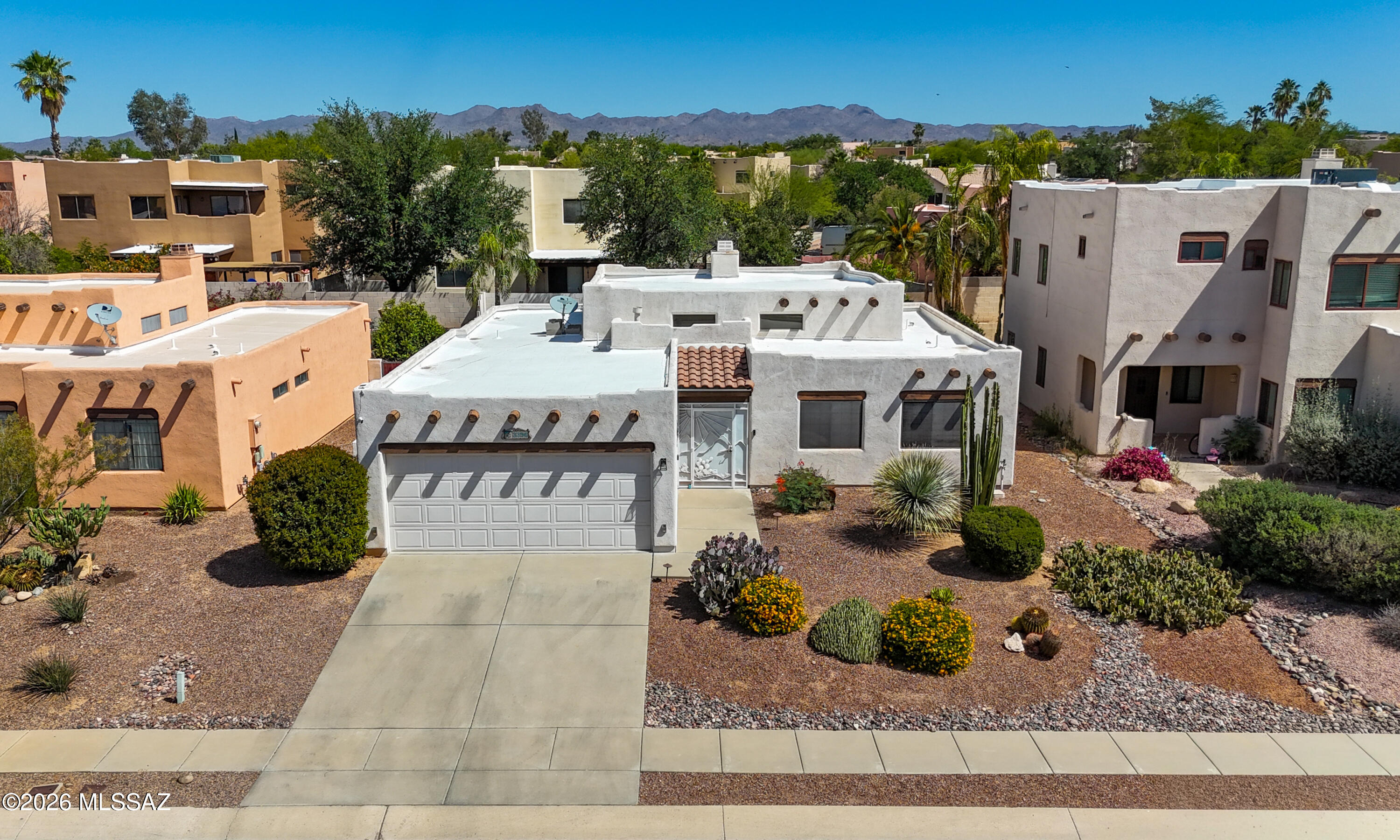 Located in Overton Heights, this Santa Fe-style home offers 3 bedrooms and 2 bathrooms. Vaulted ceilings and a fireplace highlight the main living area, bringing in natural light and a comfortable atmosphere. The kitchen features granite countertops, a stone backsplash, and a nearby separate dining area. The primary suite includes a double-door entry, large windows, and a walk-in closet. The backyard includes a pool with a waterfall, a flagstone patio, and mature landscaping providing privacy and a usable outdoor space.
