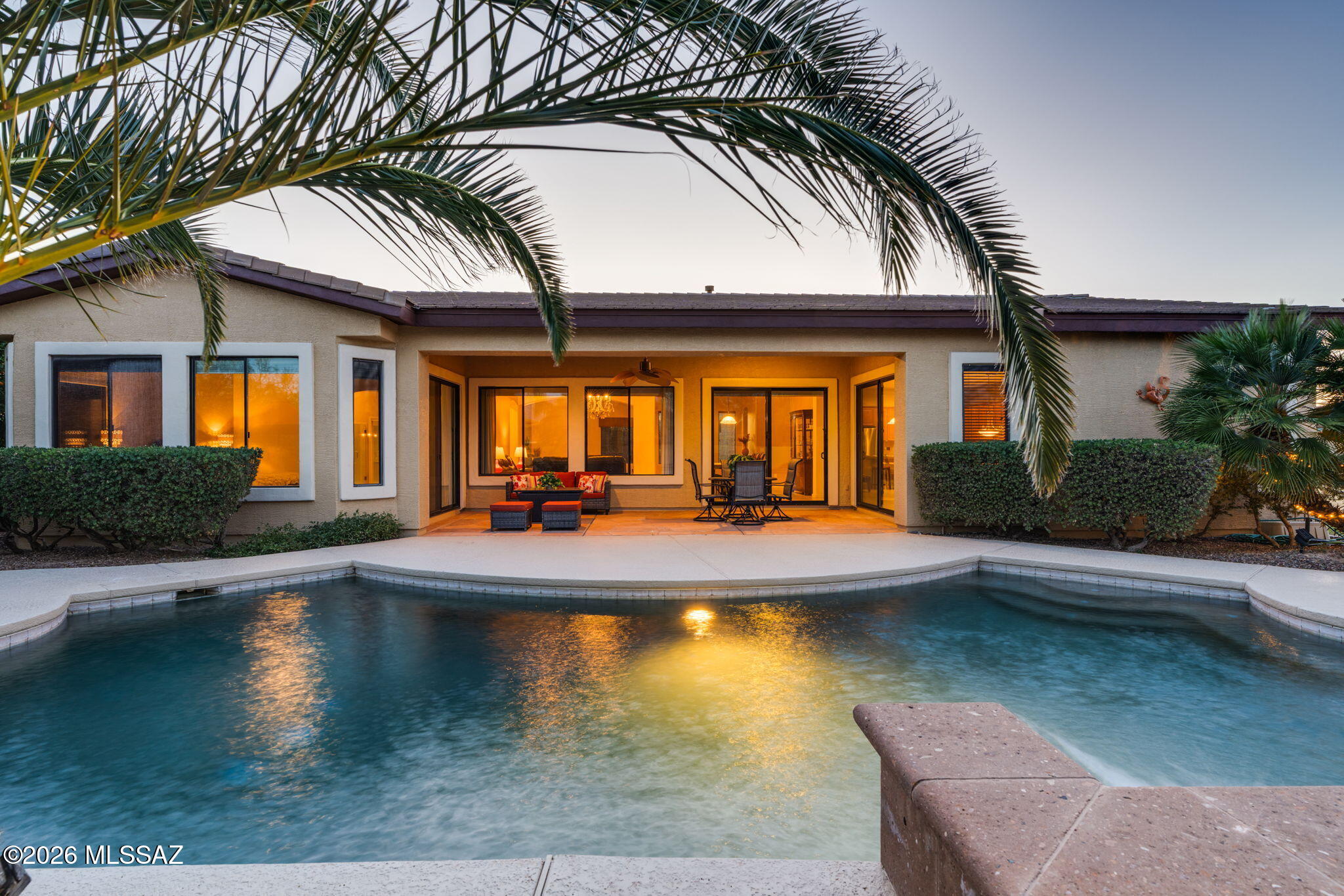 Nestled in a private Oro Valley cul-de-sac, this 3,210 sq ft residence blends luxury with peace of mind. Enjoy stunning Pusch Ridge views and significant updates, including a NEW ROOF, fresh exterior paint, and 2 NEW AC units. The bright, functional layout flows seamlessly to a resort-style backyard featuring a gas-heated pool and spa with cascading waterfalls and natural stone detailing. The expansive kitchen and large island anchor the home, perfect for entertaining. Situated on a .41-acre lot with a 3-car garage, the property offers an outdoor gas BBQ, fire pit, and extended paved patio. Located in a rare sidewalk-lined community, this home perfectly balances modern upgrades with an incredible Arizona lifestyle. Meticulously maintained and move-in ready!