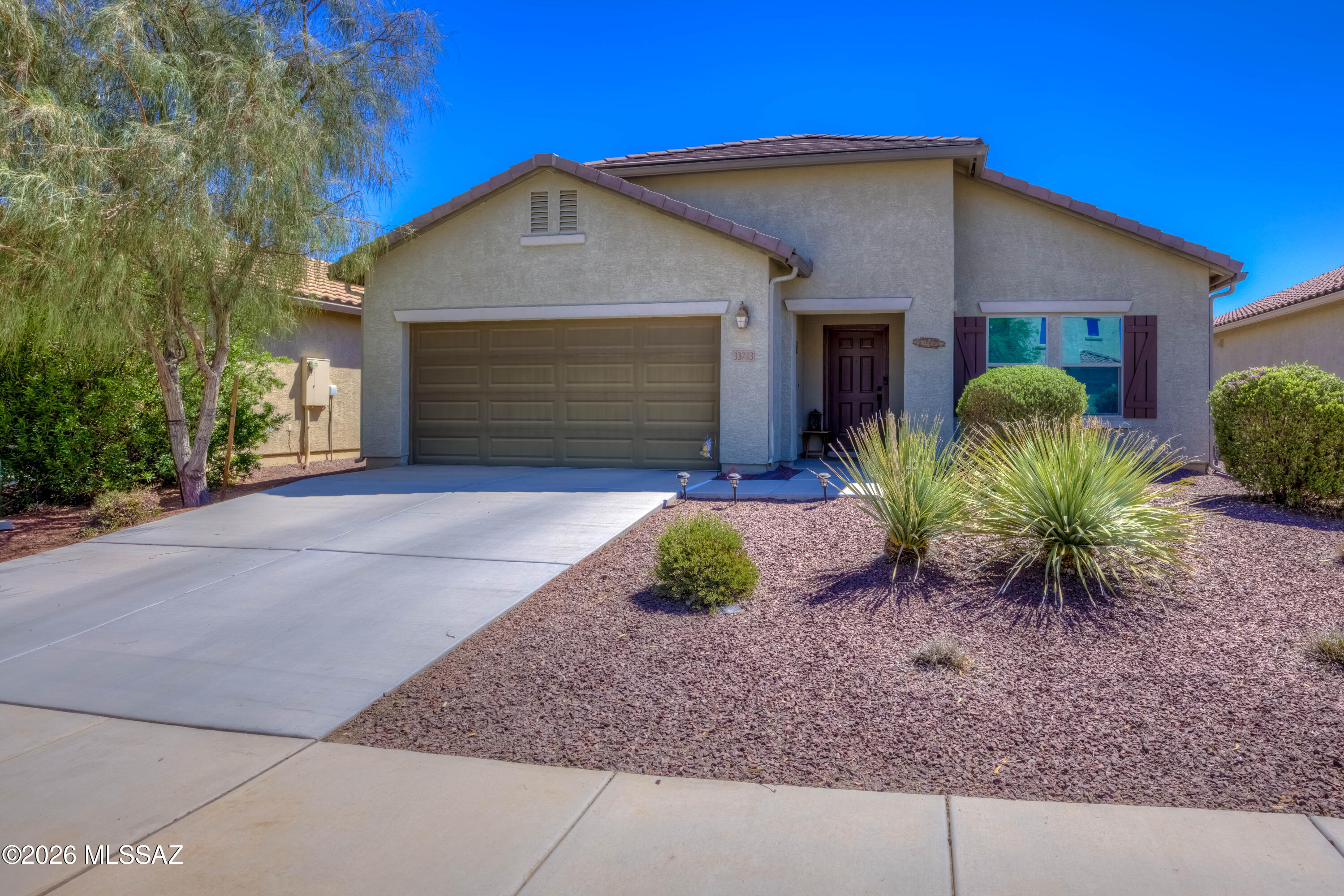 Immaculate 2018-built Red Rock home offering 2,000 sq. ft., 3 bedrooms, 2 baths, and a versatile den. The desirable split-bedroom floor plan features a spacious primary suite with a bay window for a private retreat. The open kitchen boasts granite countertops, stainless steel appliances, and plenty of workspace. Relax in the hot tub while enjoying mountain views and added privacy with a common area behind the home. Conveniently located for commuters traveling to Tucson, Casa Grande, or Phoenix, this move-in-ready home combines modern finishes, comfort, and an ideal location for families and professionals alike.  Red Rock Village has a community pool, slides, parks and a volleyball court!