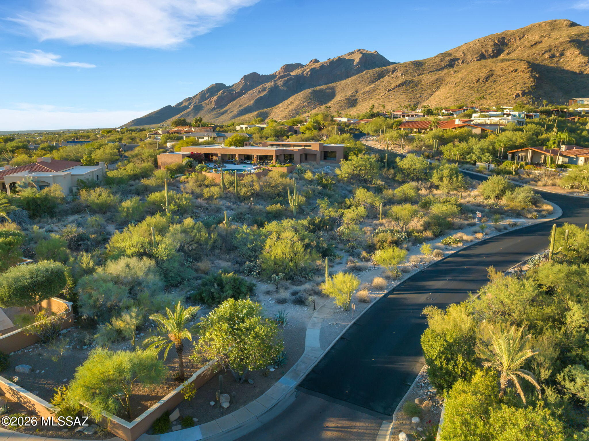 Here is a rare opportunity to purchase a premium custom homesite with breathtaking city and mountain views. This homesite is located in the supreme gated community of Cobblestone which  borders on the Santa Catalina Mountains. There are only a handful of lots left in the Cobblestone Community and this is one the few remaining parcels remaining that has great city and mountain views. The property was surveyed in 2024 and a survey plat is available for review. Also, the owner had home plans designed for this lot a number of years ago and a set of these plans are also available for review.
