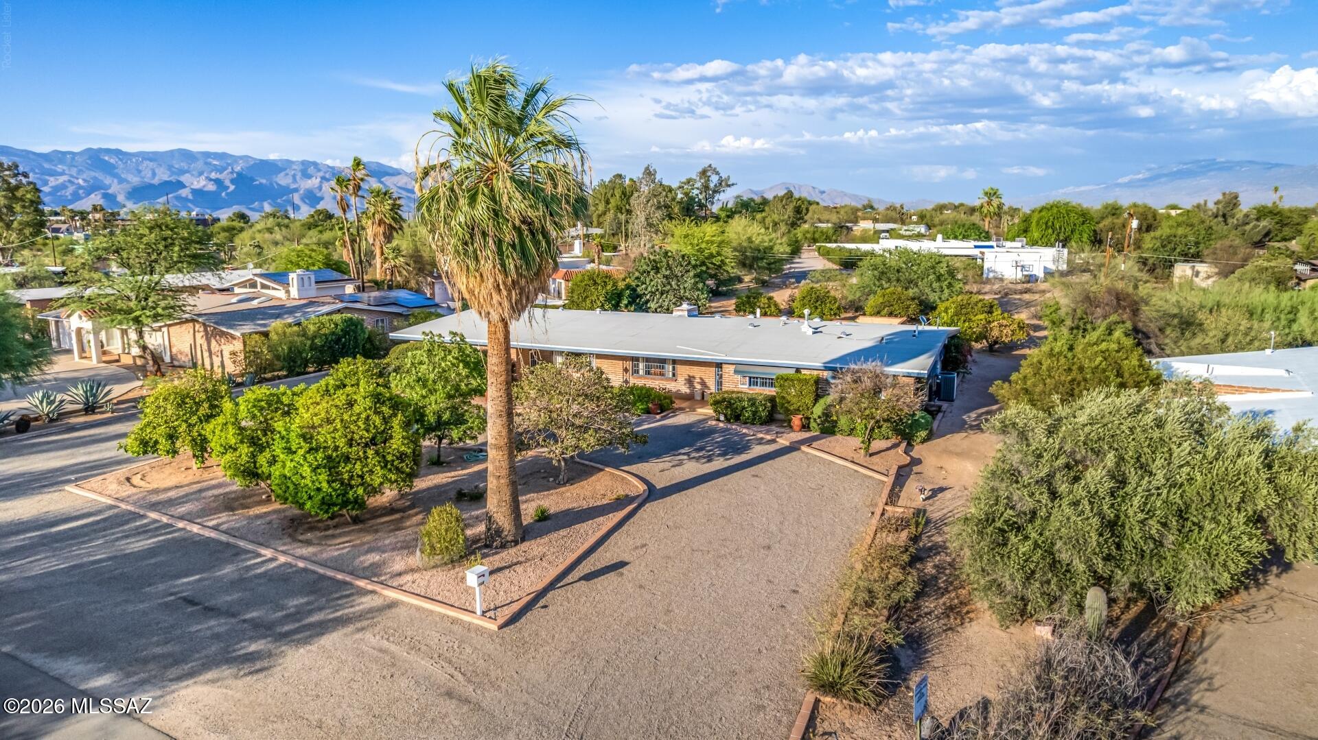 MCM Lovers look no further! Historic Harold Bell Wright neighborhood tucked back in a quiet, walkable area close to amenities. Only 2 owners. lovingly maintained and updated. Situated on almost 3/4 of an acre with a pool, citrus trees and room to park your RV. Updates include a completely new roof, updated electrical, new bathroom fans, solar screens in the spacious AZ room, solar tubes throughout, RO and owned water softener, new pool pump, MANY updates. Neutral interior color. Bedroom carpet replaced with low maintenance Marmoleum flooring to keep the MCM vibe. New poolside landscaping adds to the serene, park-like location of the home.No HOA, Historic status. Seller offering contributions towards 2-1 buy down. One seller is a licensed AZ real estate agent.