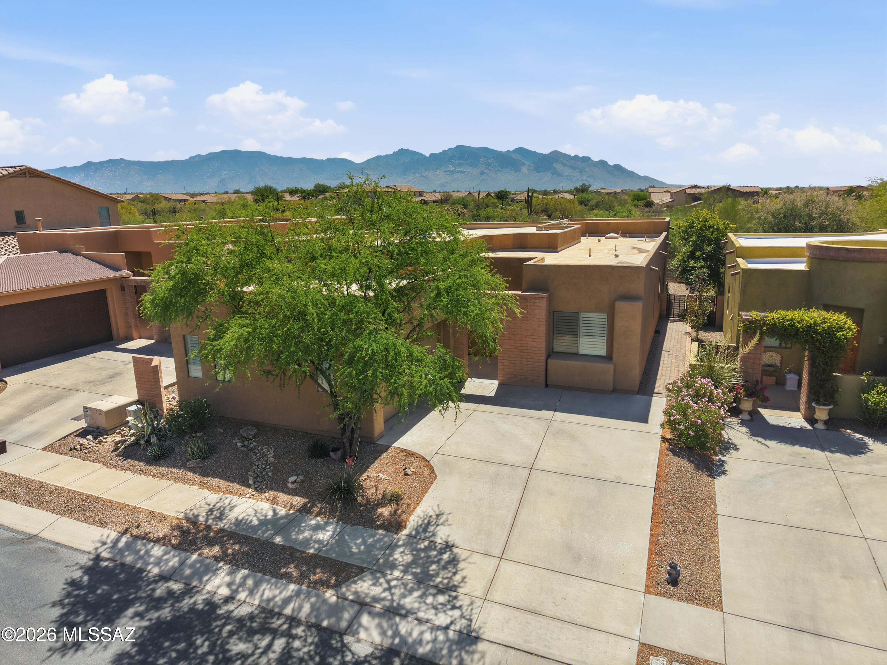 Gated Sky Ranch home in Marana offering 2,942 sq ft of thoughtfully designed living space. This 3-bedroom, 2-bath single-story residence features an open great room layout with tile flooring, high ceilings,gas fire place and abundant natural light. The spacious kitchen offers granite countertops, a breakfast bar, ample cabinetry, and a walk-in pantry--ideal for everyday living and entertaining. Split-bedroom floor plan provides a private primary suite with soaking tub, separate shower, and walk-in closet. Step outside to enjoy a private PebbleTec® pool, covered patio, and low-care desert landscaping on an irregular .14-acre lot--perfect for Arizona outdoor living. Attached 2-car garage. Conveniently located near Tangerine & Thornydale with easy access to shopping, dining, and I-10.