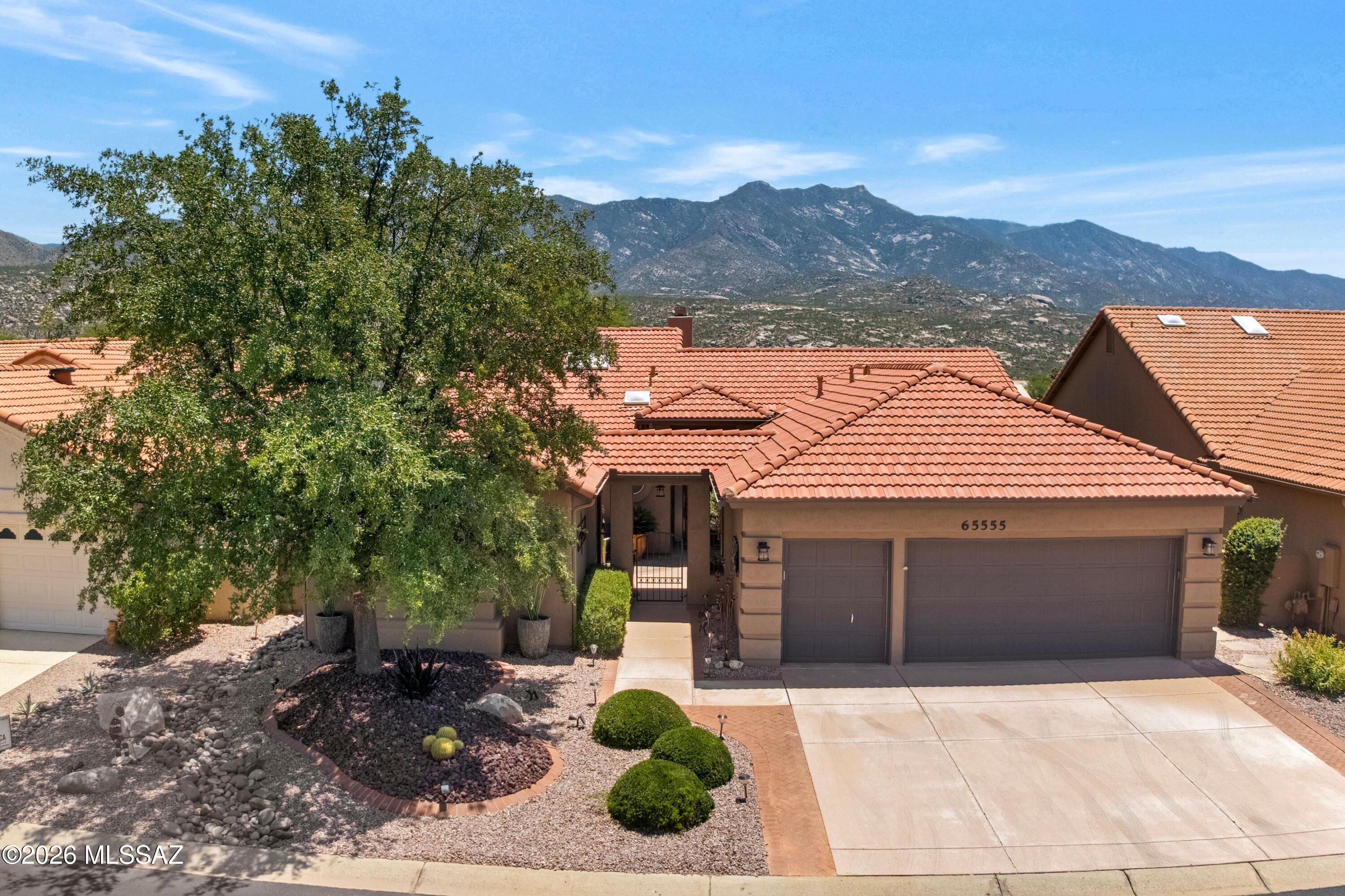 Perched high above the ''Tucson 6'' golf course, this Barcelona has Guest House, Heated Spool, & Mountain Views! Great Curb Appeal! Enclosed paver courtyard. Guest House has mini-split system, bath & walk-in closet. Inside, Great Room with gas fireplace, wall of windows, & 2 patio sliders. Dining room for entertaining. Kitchen with quartz counters, stainless/black appliances, cabinets, & desk area. Owner's Suite has double-door entry, patio slider, ensuite bath with jetted tub, walk-in shower, & walk-in closet. Guest bedroom with closet & nearby bath. Laundry Room has W/D, sink, & cabinets. Extended 2.5-Car Garage has epoxy floor, 2 HVAC's, W/H, side door, & storage. Covered paver patio, extended paver patio with heated spool, lovely landscaping, gated yard, golf & mountain views to enjoy!