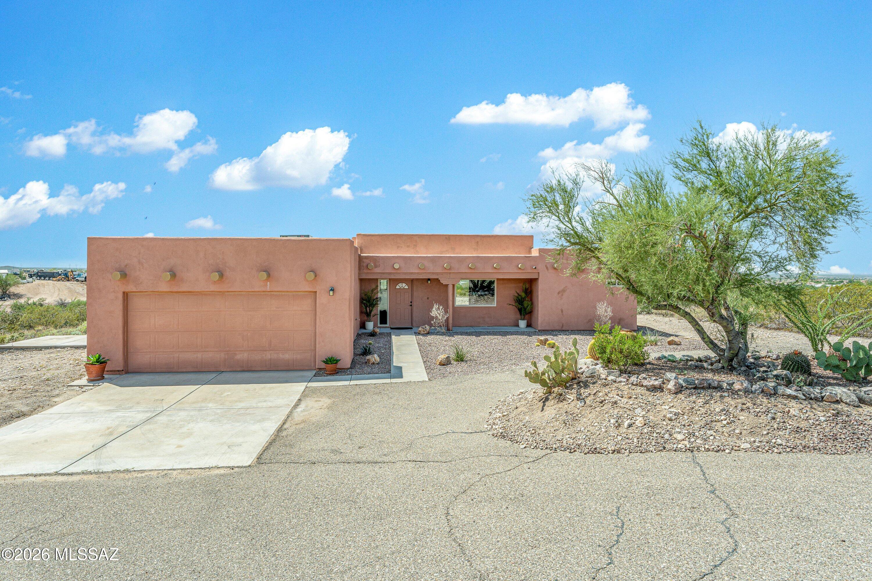 Grand, sweeping valley & mountain views from this elevated lot near Cienega Creek Preserve will have you in awe! Don't miss your chance to own this bright, clean home...with no HOA! Relax on the back porch to check out a sunset & Picacho Peak, or watch the sun rise from the front porch with newly landscaped yard & abundant desert wildlife. Inside, enjoy functional space: split bedroom/greatroom floor plan, fresh paint, plantation shutters, & new carpet in beds 2-4. Major upgrades are covered with new water heater (2026), roof (2026), termite treatment (2026), & HVAC (2023). With rural residential zoning & 1.9 acres, you have plenty of space to utilize in many ways. Feels remote yet just minutes to shopping, eating, & in/outdoor activities. Get it before it's gone!!