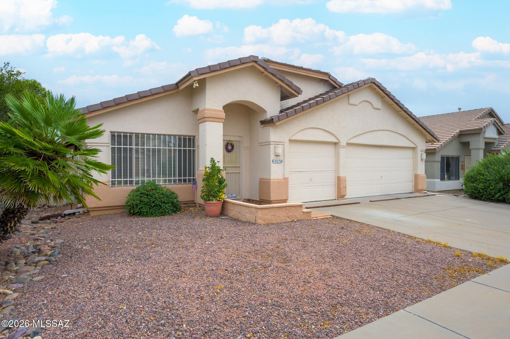 Beautiful three bedroom home with an office that can be easily converted to a fourth bedroom on the east side of Tucson. The primary bedroom features a double vanity, walk-in closet, garden tub and separate shower. The guest bathroom also has a double vanity. This spacious home has an open floor plan with a separate family/dinning room at the front of the house. The kitchen has plethora of counter space and the cabinets feature sliding drawers for ease of access with a breakfast bar. The low maintenance backyard features a covered patio area and turf with room for a garden. This house comes with a three car garage that is great for multiple cars and/or storage.