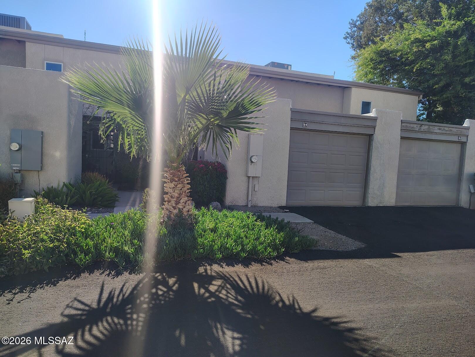 This is it!  The home you've been looking for! Beautifully updated 2-story, 2 bd, 2 ba in
Pima Park/Riverview Condominiums. Lower level has kitchen with newer appliances, granite c/tops and pass-thru to the dining room. Spacious great room features dining and living areas with vaulted ceilings. wood floors, updated lighting, and a beehive fireplace w/ custom tile, second bedroom, and full bath w/ dark cherry cabinets, granite c/top, skylight and tile surround. Upper-level boasts a large master suite with a loft view of downstairs, sitting area, huge walk-in closet, master bath & private balcony with a view. Private yard has Saltillo tile patio, fountain & gate that leads to grass courtyard and community pool.  Furnished/unfurnished option avail. Some or all of the furnishings can be sold separately through a bill of sale. Otherwise, furniture can be completely removed prior to close.