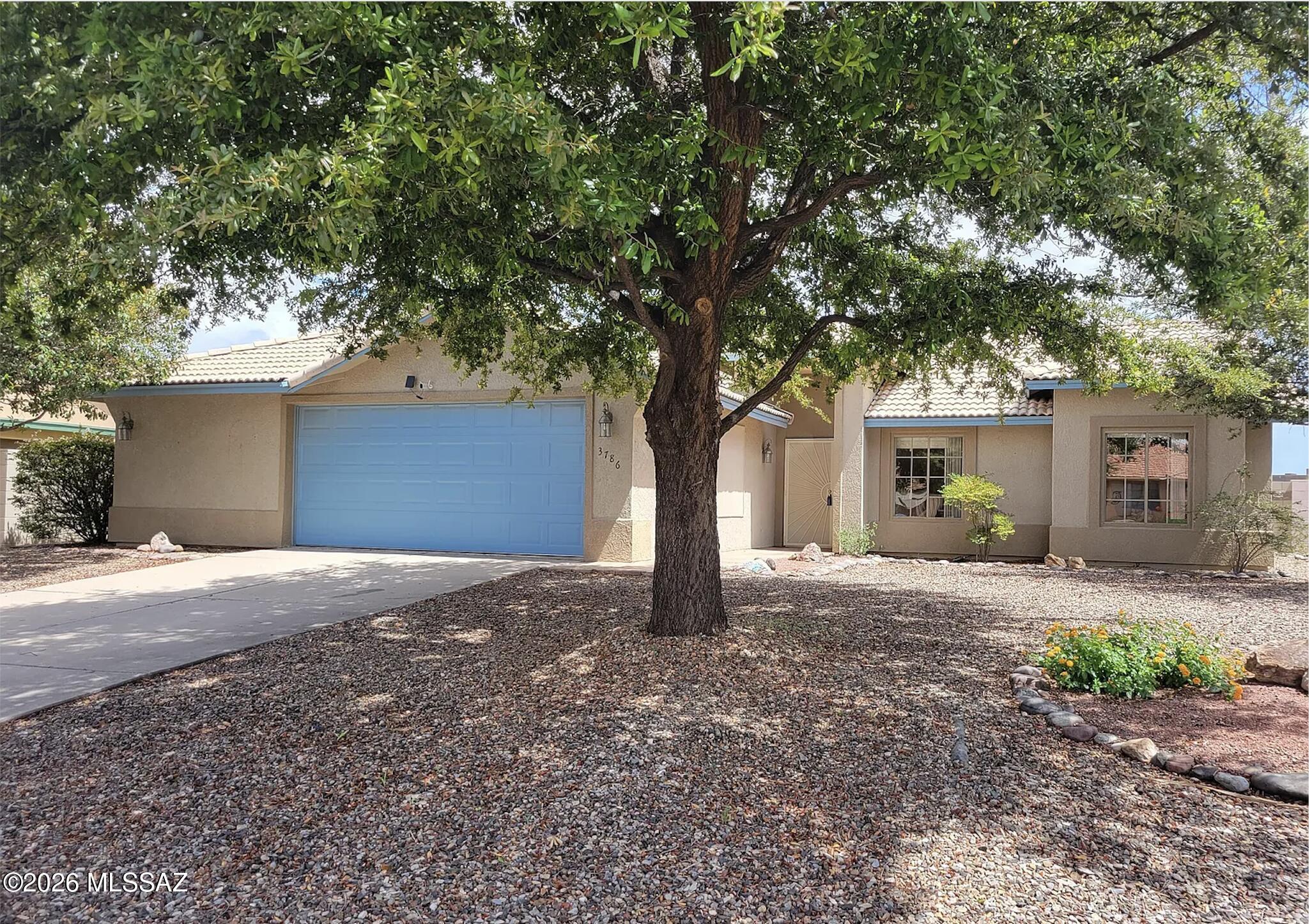 Beautiful turnkey former model home in desirable Canyon De Flores with no HOA. This 3 bedroom, 2 bath, 1,700 sq ft ranch features a bright great room floor plan with vaulted ceilings, skylights, and a well-appointed kitchen with pantry and all appliances. Easy-care front desert landscaping and a private backyard with artificial turf, desert plantings, and covered patio make outdoor living a breeze. Oversized 2.5-car garage, tile roof, block wall, and convenient location near Ft. Huachuca, schools, and shopping.