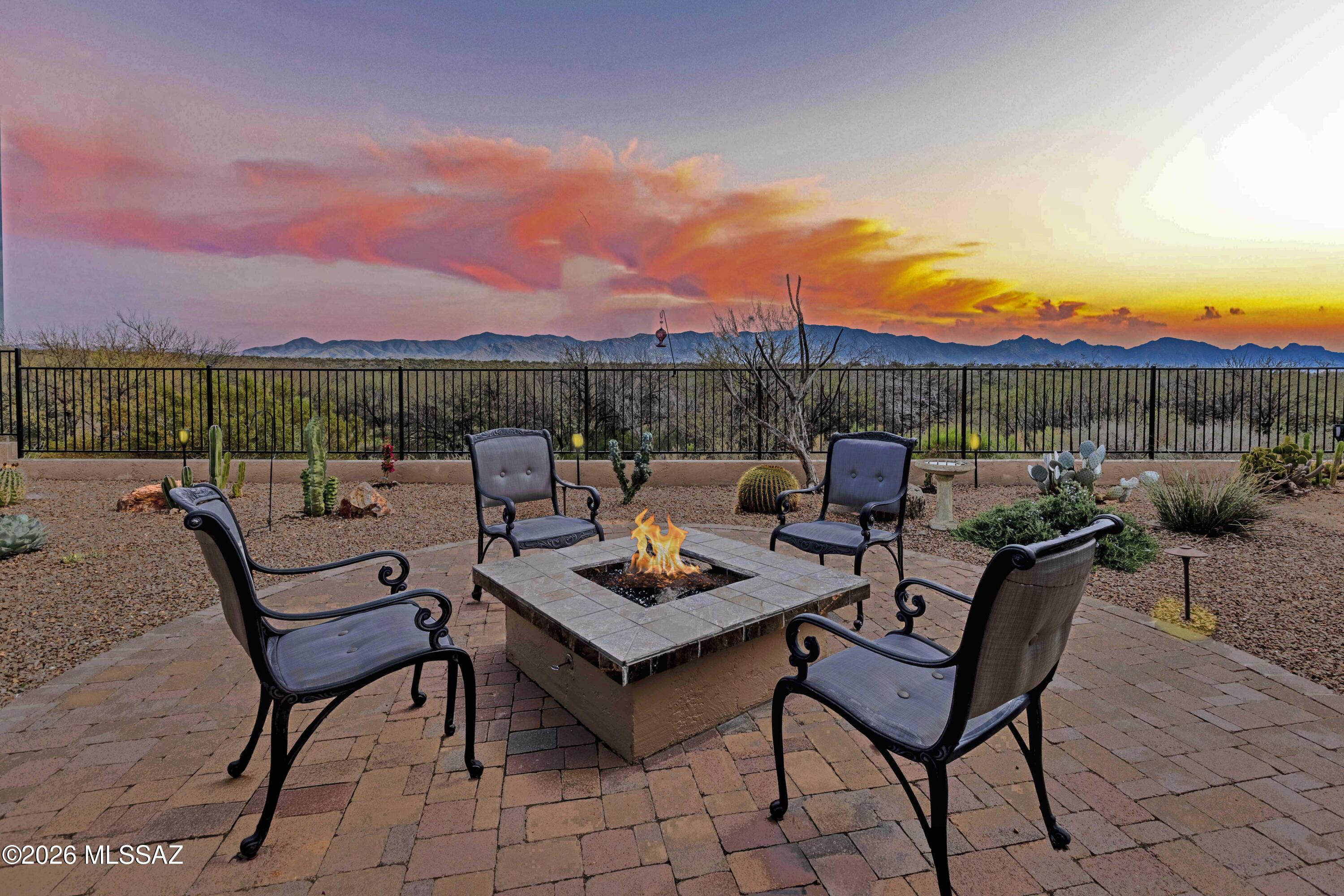 Wake up each morning to unobstructed, breathtaking views of the Catalina Mountains -- a backdrop that truly sets this home apart. Designed for effortless desert living, the expansive outdoor retreat invites you to savor morning coffee, sunset gatherings, and peaceful moments surrounded by nature. Inside, the home is richly appointed with upgraded cabinetry, striking granite countertops, and thoughtfully curated finishes throughout. The spacious primary suite offers a private sanctuary, while a secondary ensuite bedroom and a custom-built office provide comfort and flexibility. A private casita with a full bath completes the experience, offering the perfect space for guests or extended stays. This is desert living at its finest -- elegant, private, and unforgettable.