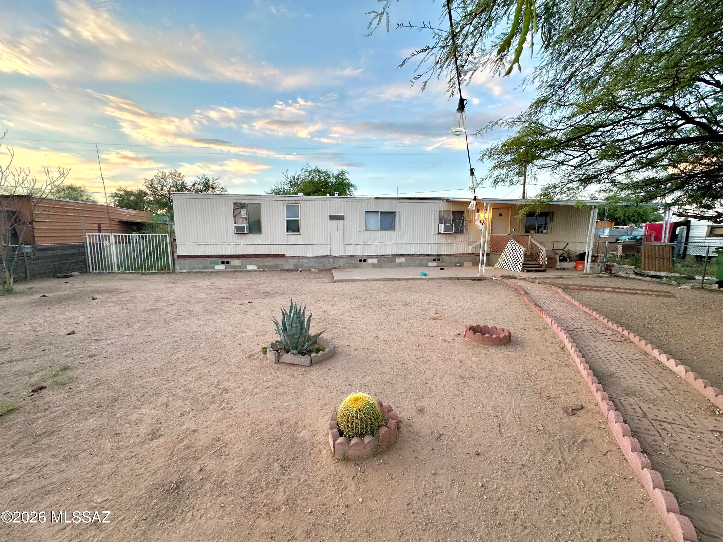 Manufactured home with 2 bedrooms and a large addition which has functioned as the 3rd bedroom, office, storage etc as needed. Cozy and Functional with storages in the back yard, plenty of parking and larger fenced front yard. Neat spot in a convenient location in growing SW!