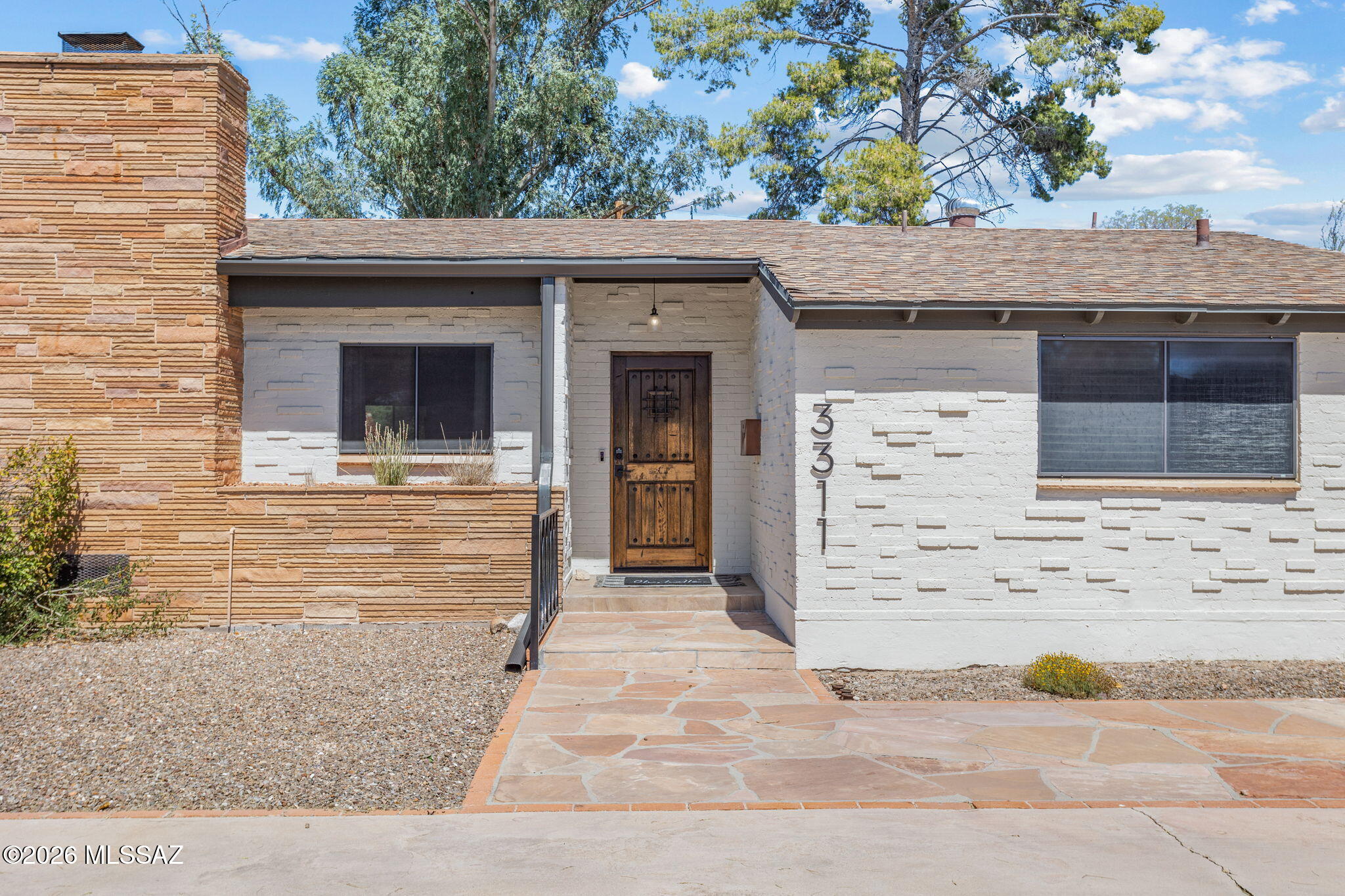 Experience modern luxury in this beautifully appointed 4-bed, 3-bath Midcentury home! The spacious, open floorplan flows into a chef's kitchen featuring quartz countertops, premium cabinetry, and more! Notable updates abound, including refreshed bathrooms highlighted by a Velux skylight in the primary suite. The backyard is a designer masterpiece envisioned by Kathryn Prideaux, featuring a sparkling saltwater pool and lush landscaping. This move-in-ready gem includes smart home features and an upgraded electrical panel ready for an EV charger. Nestled in the desirable Encanto Park neighborhood within the Sam Hughes school boundary, you are perfectly positioned near the UofA, Banner Medical, and Downtown. Lastly, enjoy unparalleled walkability to Whole Foods, Miramonte, La Rosa and more!