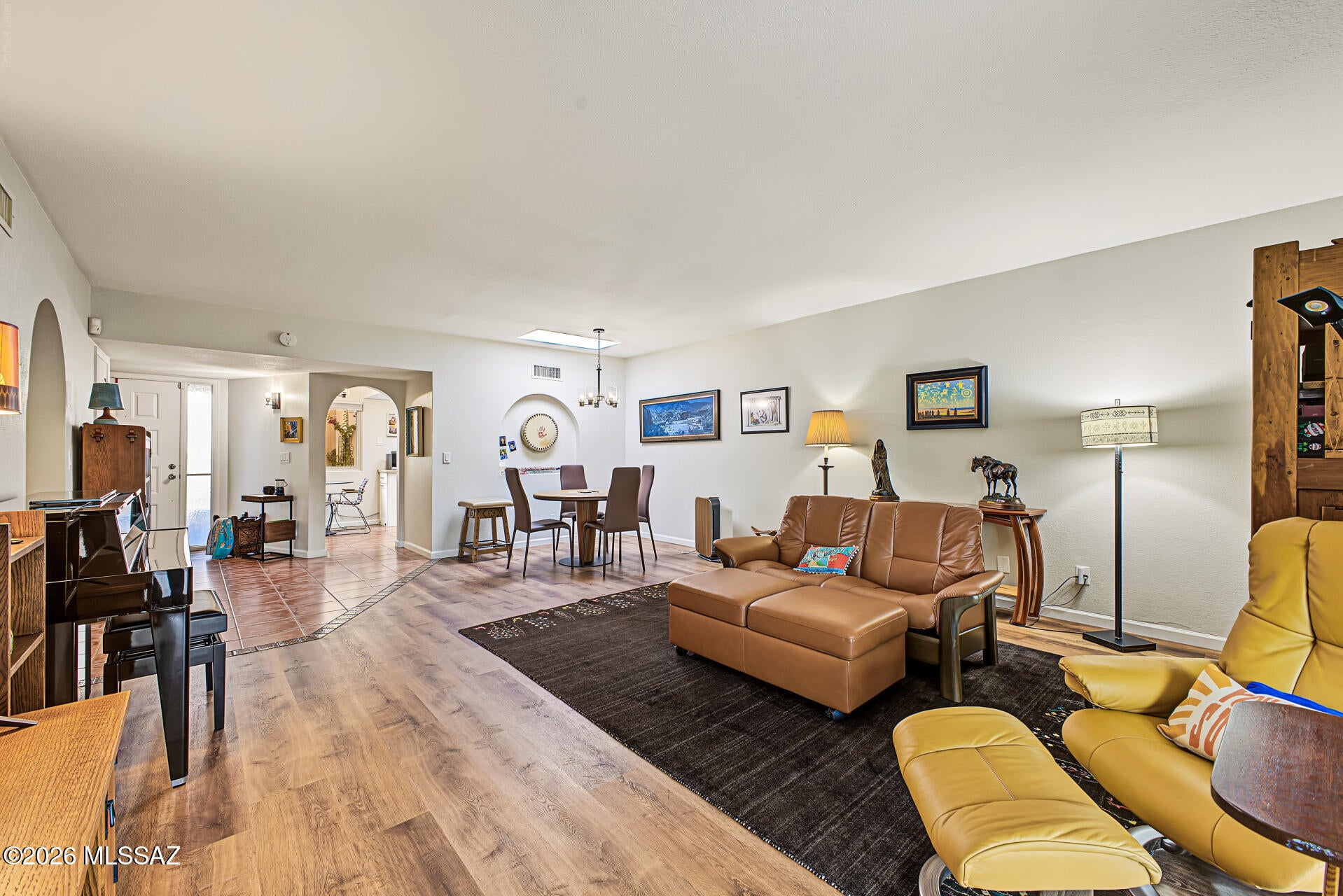 Range-Priced $435-$445K.Completely Remodeled! Charming townhome in a gorgeous & quiet Foothills neighborhood! 2 beds, 2 baths, a 2-car garage, and an inviting gated walkway bordered by lush greenery leading to the front entrance. Inside you'll find tons of natural light, tile in high-traffic areas, and a generous living area. Updated eat-in kitchen boasts recessed lighting, skylights, newer cabinets, granite counters, and newer SS appliances. The primary bedroom offers direct patio access and a private bath for added convenience. Built-in cabinetry in the laundry room provides additional storage. Outside, a covered patio w/exposed wood beams, a separate paver seating area, and plenty of space for relaxing and entertaining. Enjoy a community pool & spa, tennis.