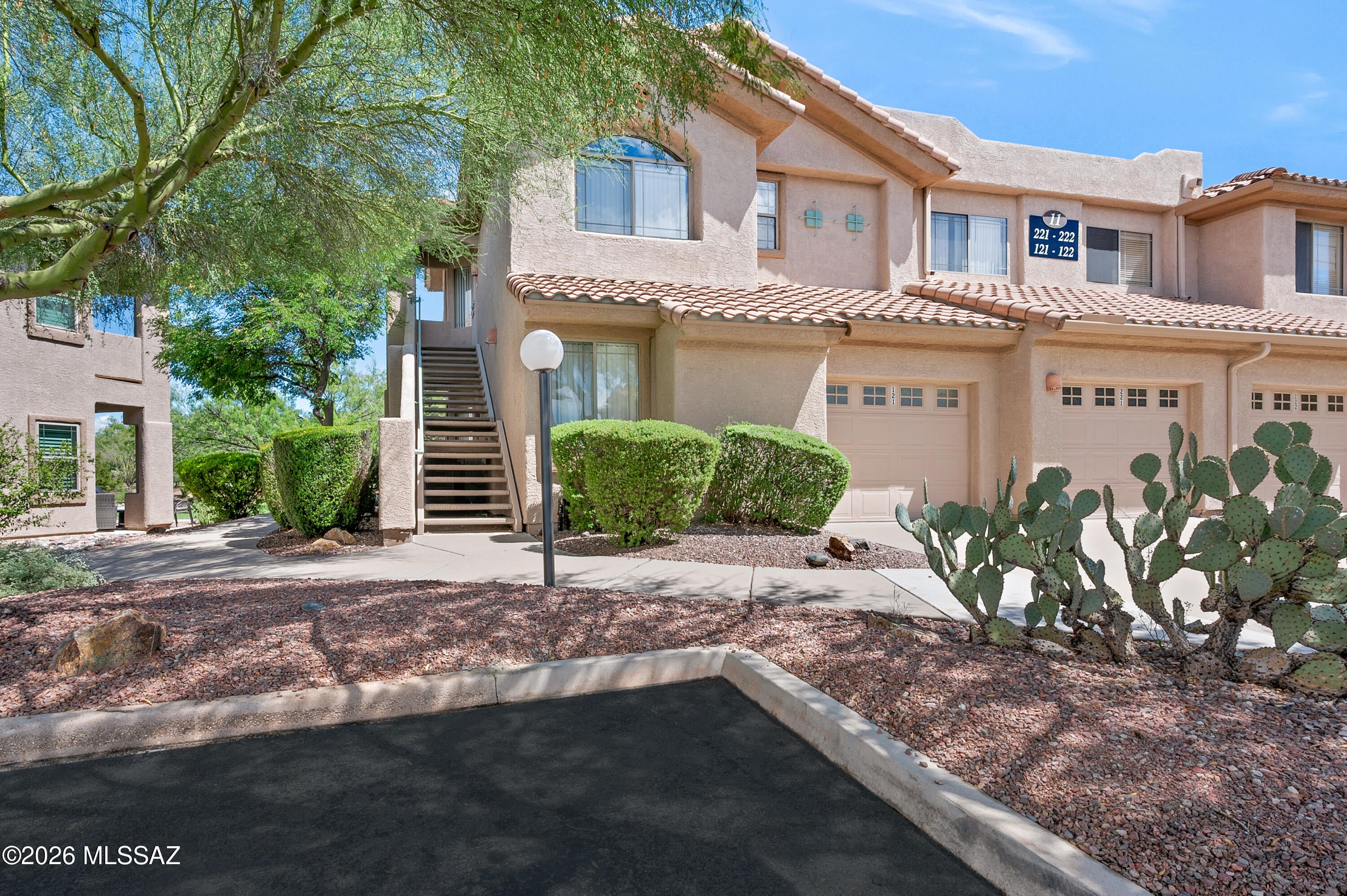 Location may be everything, and this Vistoso casita has it. Tucked within the Vistoso Trails Nature Preserve, this beautifully maintained ground-floor condo offers an exceptional setting, with the heated community pool and BBQ area just outside the back patio and the new Vistoso Trails pond being created only a few steps from the front door.
Gently used and lovingly maintained by the same family, this casita offers an easy, comfortable place to call home, whether you're looking for a winter retreat, a lock-and-leave residence, or a vacation rental opportunity.
The split-bedroom floor plan provides privacy for owners and guests, while the spacious primary suite includes a large walk-in closet. The home has been carefully maintained over the years, with a brand-new air-conditioning system and a recently replaced refrigerator/freezer and water heater, providing peace of mind for the next owner.
Step out onto your private patio and you're just steps from the heated pool, spa and community BBQ area--close enough to enjoy as an extension of your own backyard. In the other direction, the new Vistoso Trails pond will add another beautiful element to this special location.
An attached garage provides convenient parking and additional storage, while the HOA includes internet, water, individual trash and recycling, basic Xfinity cable, exterior pest control, exterior maintenance and painting, heated pool and spa, recently renovated fitness center, community grill and community landscaping.
With Vistoso Trails just outside your door and Oro Valley's golf, hiking, dining and shopping nearby, this is Arizona living made easy.
Come for the winter. Stay for the lifestyle. Lock the door and leave whenever adventure calls.