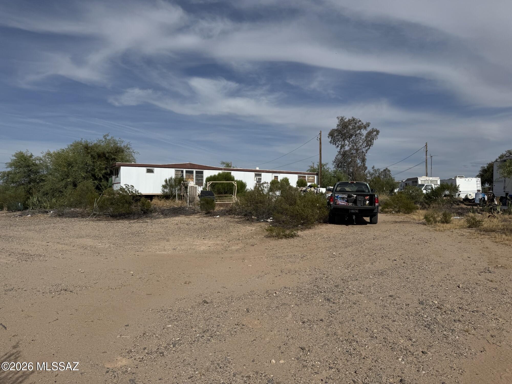 An unaffixed single wide mobile home on a large corner lot in Marana - needs lots of work to make it beautiful. Priced for quick sale, make an offer.