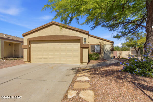 Save $$$, all appliances included, free electricity from your owned solar panel system. Access to the ''Tucson Loop'' is at the end of the street. This home is in tip top condition for this 3 bedroom 2 bath home that is ready to move right in now. Easy care back yard, mostly concrete with planters. 2 car garage and most all of the yard furnishings are also included, too! One year buyers home warranty comes with the home also. Come see it today!