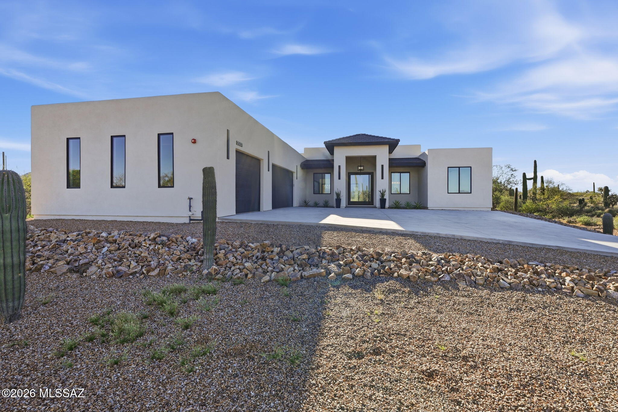 Private 1-Acre Cul-de-Sac | Mountain Views. Custom 4-bedroom, 4-bath residence set on a full acre in a quiet cul-de-sac, offering modern finishes and rare expansion flexibility. Light-filled living spaces flow into a chef's kitchen with custom cabinetry, quartzite island, 48-inch induction range, and walk-in pantry. The owner's suite features a spa-style bath with soaking tub, oversized shower, dual vanities, and custom closet. Elevated details continue throughout, including a functional laundry room with built-in storage and dog wash. The expansive homesite provides privacy and room to build your vision- detached garage, guest quarters, pickleball court, workshop, or custom perimeter wall. Owner/Agent. **Seller will consider buyer incentives, including contributions toward outdoor improvements.