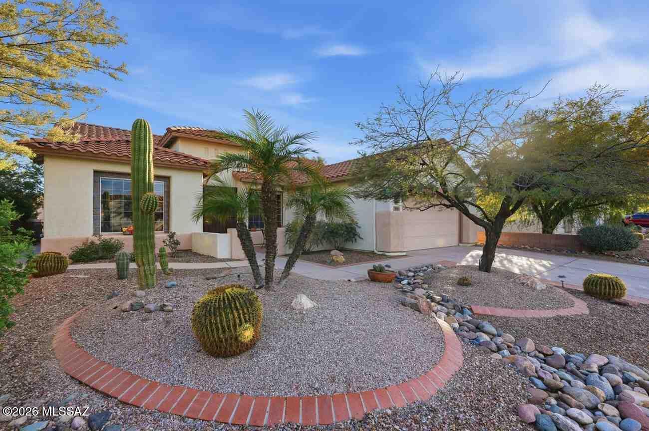 Spacious and highly sought-after Kachina floorplan featuring 2 bedrooms, 2 bathrooms, and a versatile den complete with a custom Murphy wall bed--ideal for guests or a home office. The thoughtfully designed kitchen showcases rich cherry cabinetry, upgraded quartz countertops, and a functional island perfect for entertaining and everyday living. Step outside to a beautifully designed desert-landscaped backyard with an extended covered patio, creating the perfect space to relax or host gatherings. Enjoy the charming beehive fireplace and take advantage of the built-in BBQ grill for effortless outdoor entertaining. Located in the desirable active adult community of Sunflower, offering convenient access to community amenities, recreation, and nearby shopping and dining.