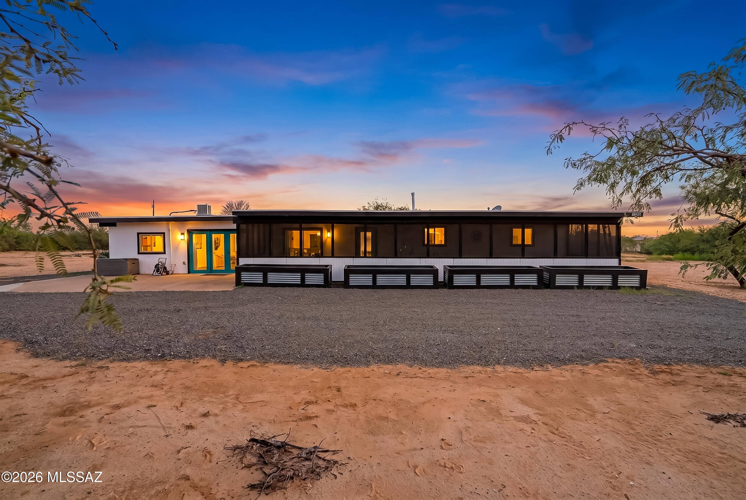 Welcome to peace, tranquility and starry, starry nights. This newly updated home sits on five acres of desert surrounded by beautiful views. New roof in 2025, completely redone kitchen including new cabinets, appliances, countertops, HUGE amazing island, new lighting, new flooring throughout the home, and more.  New fully enclosed front porch lets you enjoy the beautiful Tucson weather and helps keep the house nice and cool.

Two primary bedrooms, plus at the rear of the five fully fenced acres, with septic/water/electric for future home/guest house for multi generation living, or potential lot split.  Maybe you'd like to put an artist retreat or workshop back there.  The possibilities are endless.  While you're dreaming big, how about taking up gliding at nearby Ryan Airfield!? Large laundry area just off kitchen.  Larger bonus/storage room off primary suite.  This home has a place for everything!
