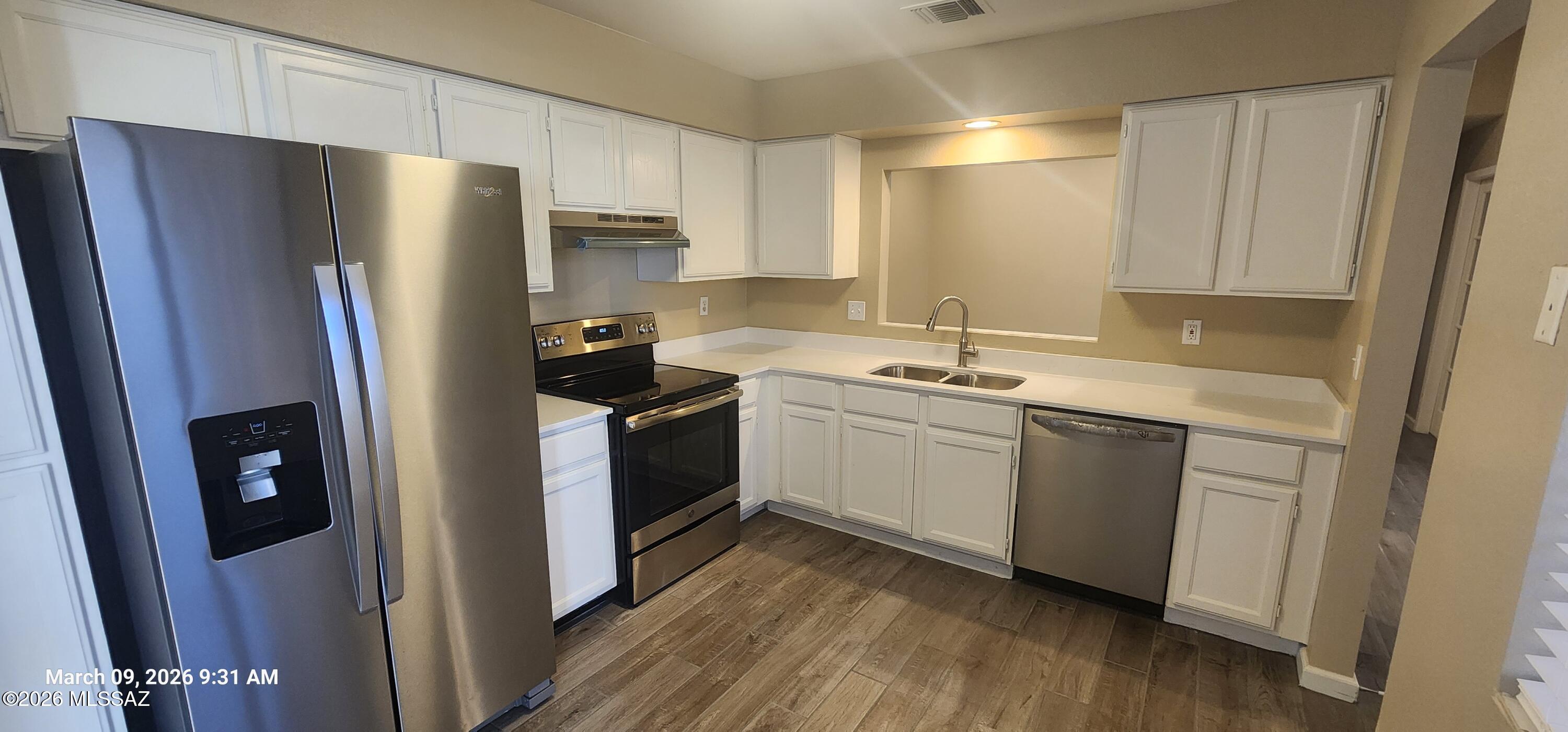 Discover this inviting 2-bedroom townhouse featuring a spacious bedroom sized den and 2 full bathrooms. Enjoy recent upgrades including new quartz countertops, fresh tile, and plush carpeting in bedrrooms.  Located in a private gated community, this home offers a two-car garage for your convenience. Water and trash services are included in the rent. You'll love the easy access to Pima Community College, UofA, shopping centers, and the freeway. Make this beautifully updated townhouse your next home!
