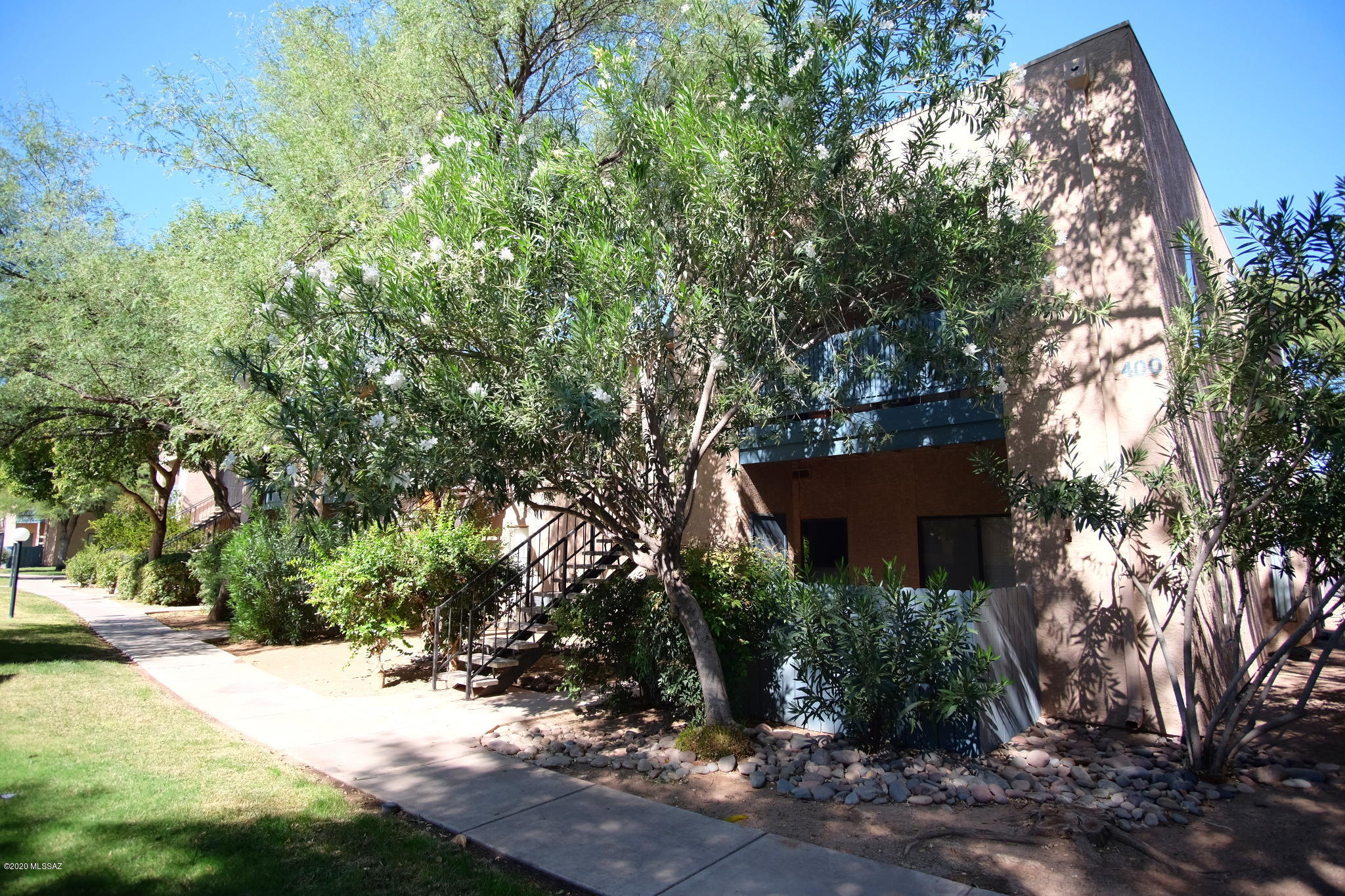 Text for a Walkthrough Video/more info. Ground floor end unit, 2 bedroom/2 bathroom condo with 1032sf of living space located in the conveniently located Rincon Village. Well maintained throughout, concrete floors, private master BR suite with walk-in closet and washer & dryer included, central air conditioning, carport space, and a private shaded & gated patio overlooking the Community Pool make this a great place to call home. 1yr minimum Lease. Costs incl; Non-refundable $50/adult Application, $1150 Security Deposit, $150/pet with approved pet, $300 cleaning. Tenant pays electric only. Available immediately.