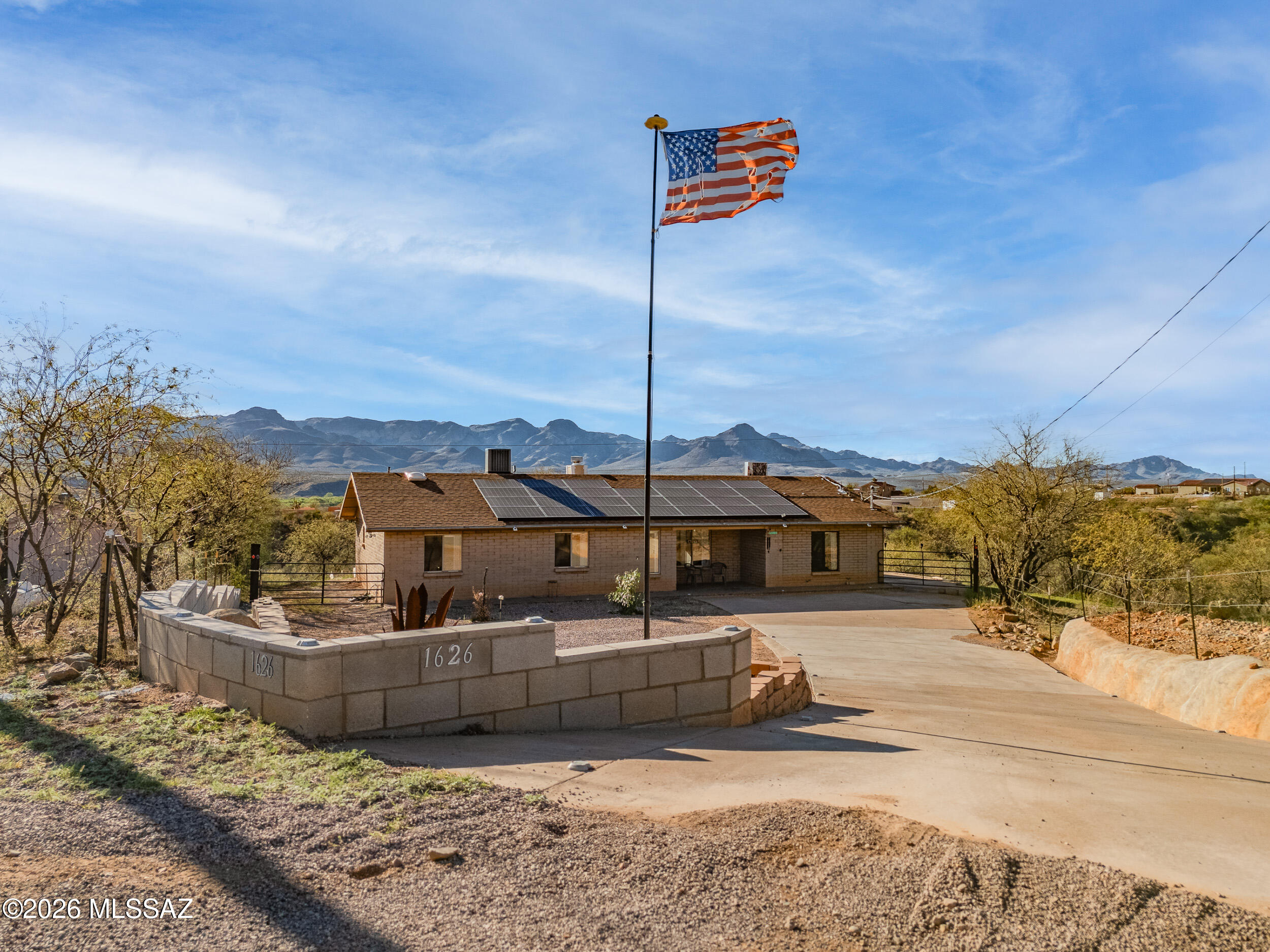 Surrounded by breathtaking mountain views, this inviting 3 bed, 2 bath home with a dedicated office and spacious Arizona room offers the perfect blend of comfort and scenery. Inside, you'll find a bright, open layout with versatile living spaces ideal for working from home or relaxing with family. The Arizona room provides the perfect spot to enjoy peaceful mornings, vibrant sunsets, and year-round indoor-outdoor living. Nestled in a serene setting with stunning natural beauty in every direction, this home delivers privacy, tranquility, and room to live the lifestyle you've been dreaming of.
